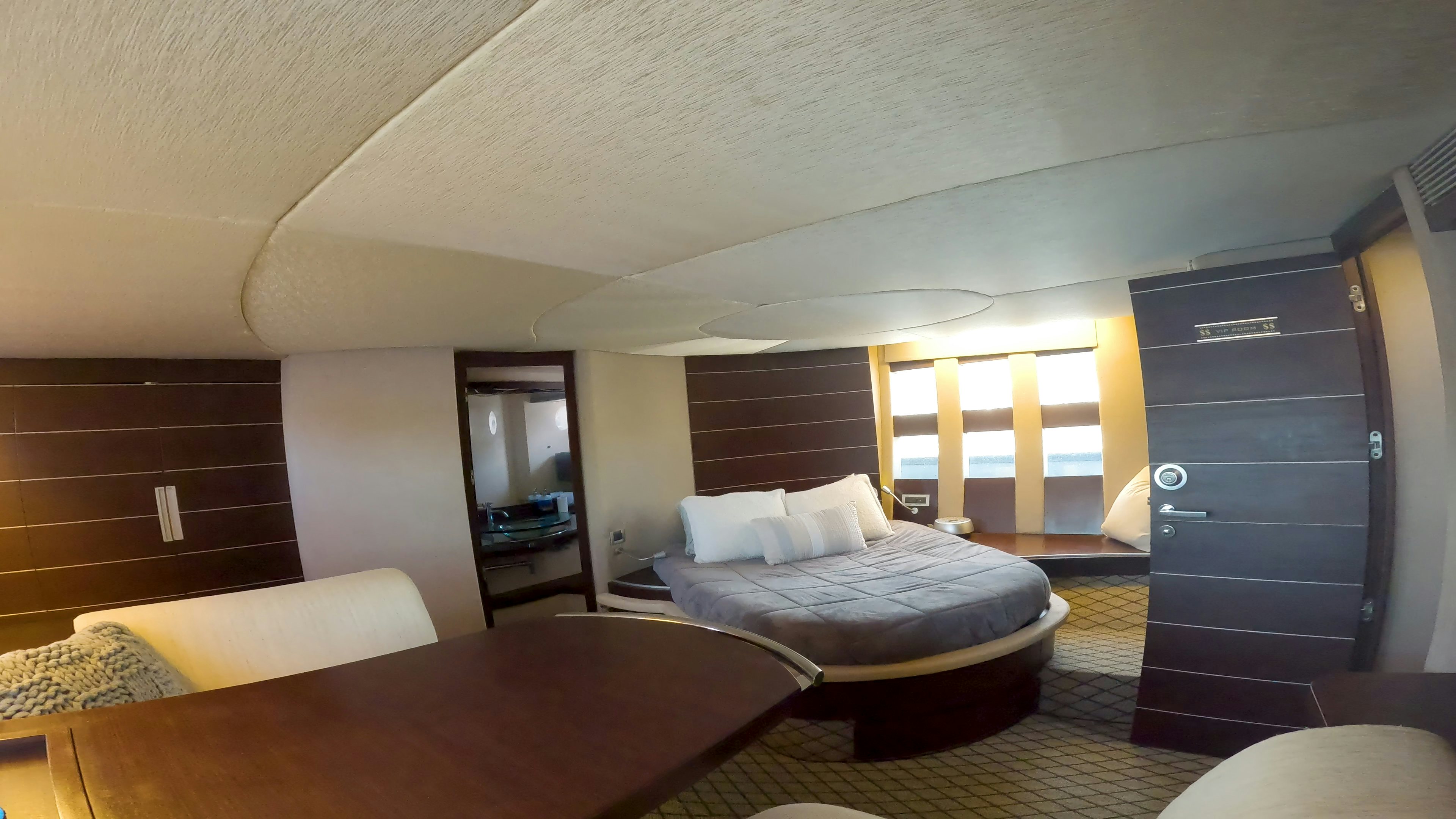 a room with a bed and a table aboard BOAT Yacht for Sale
