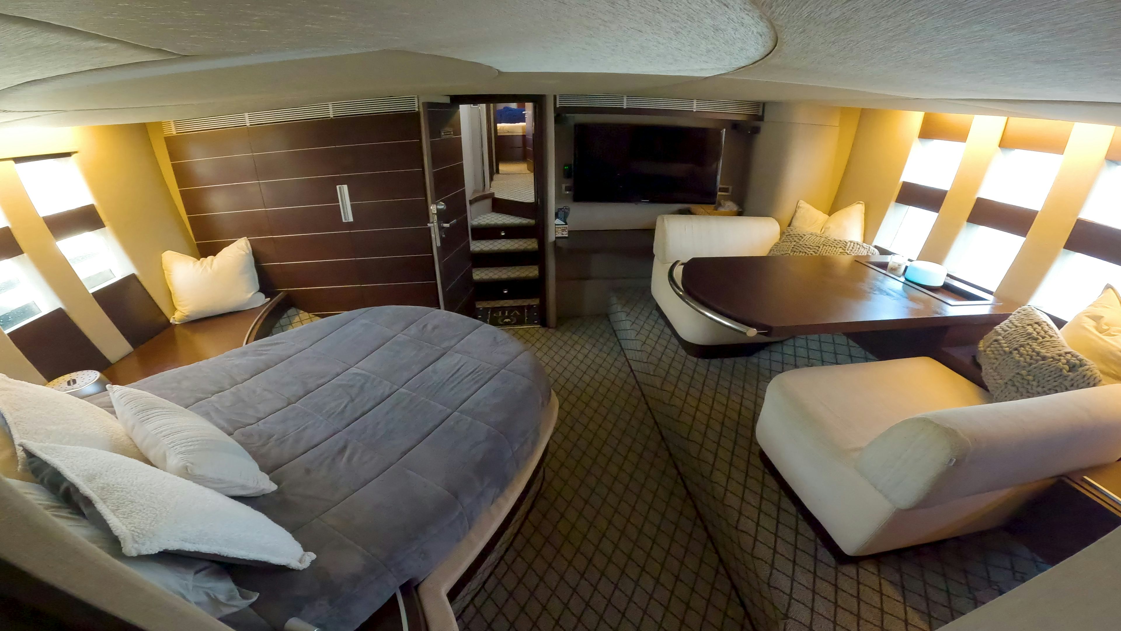 a room with a bed and a table aboard BOAT Yacht for Sale