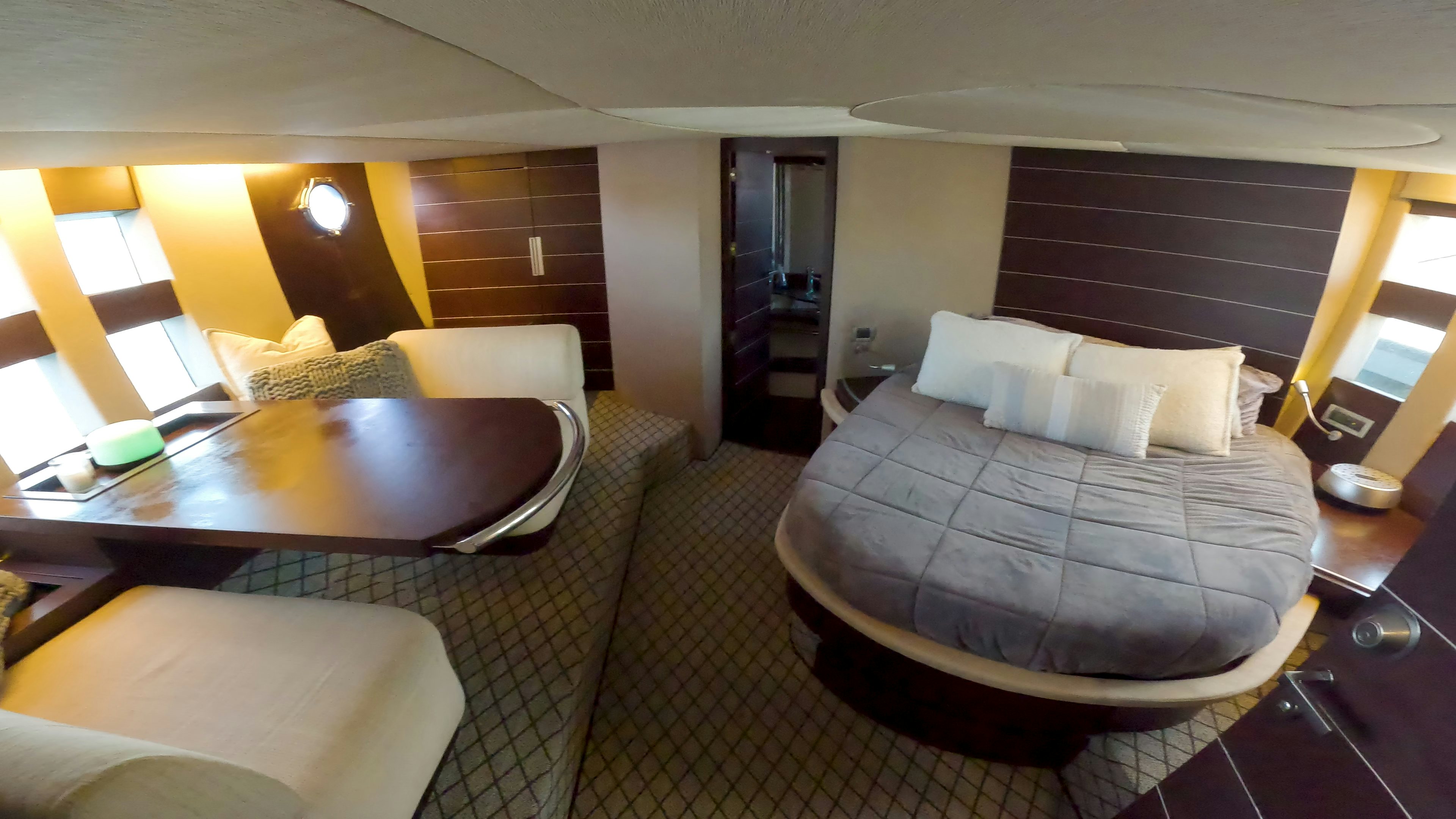a room with a bed and a table aboard BOAT Yacht for Sale
