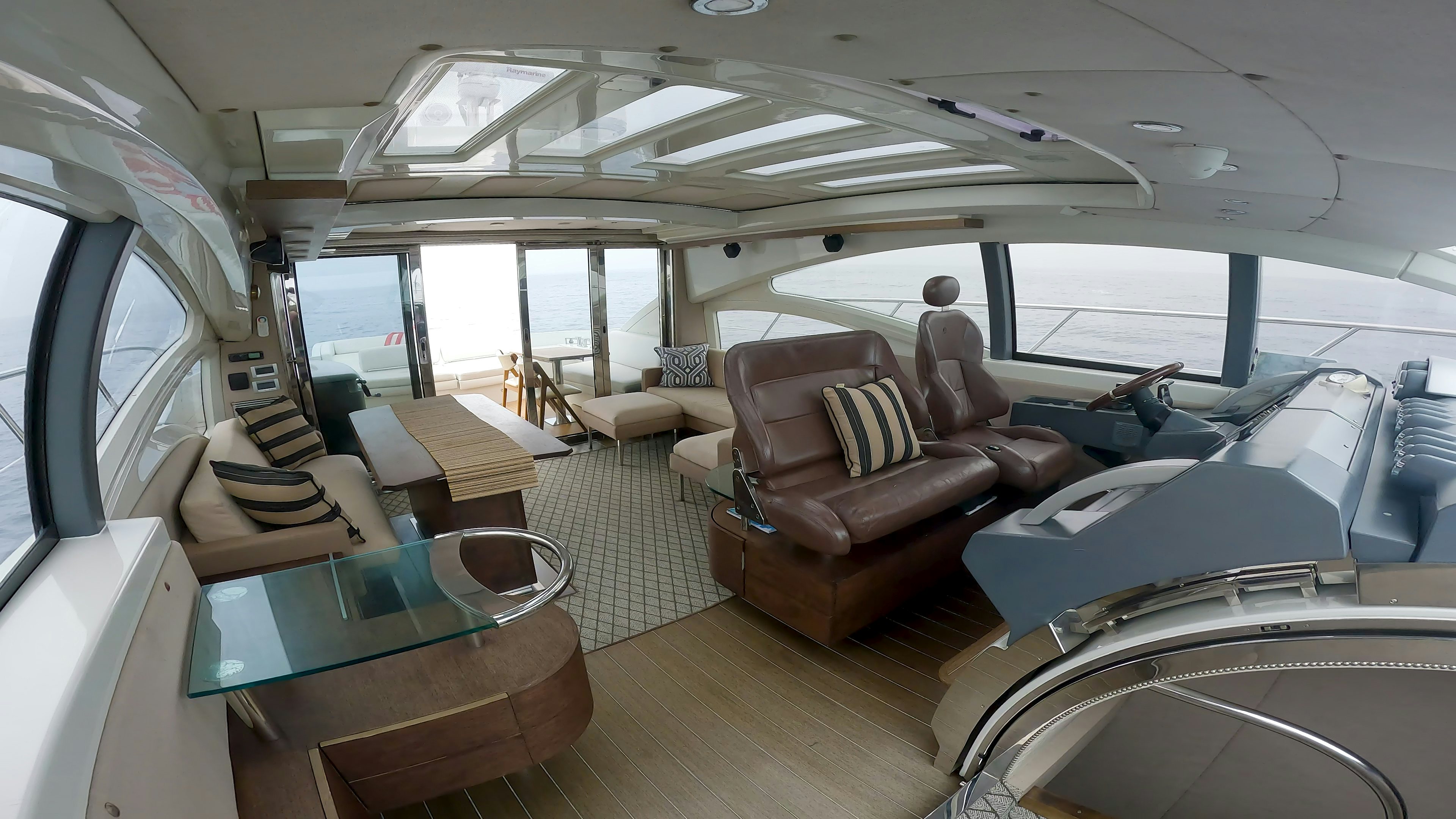 inside of a vehicle with a table and chairs aboard BOAT Yacht for Sale
