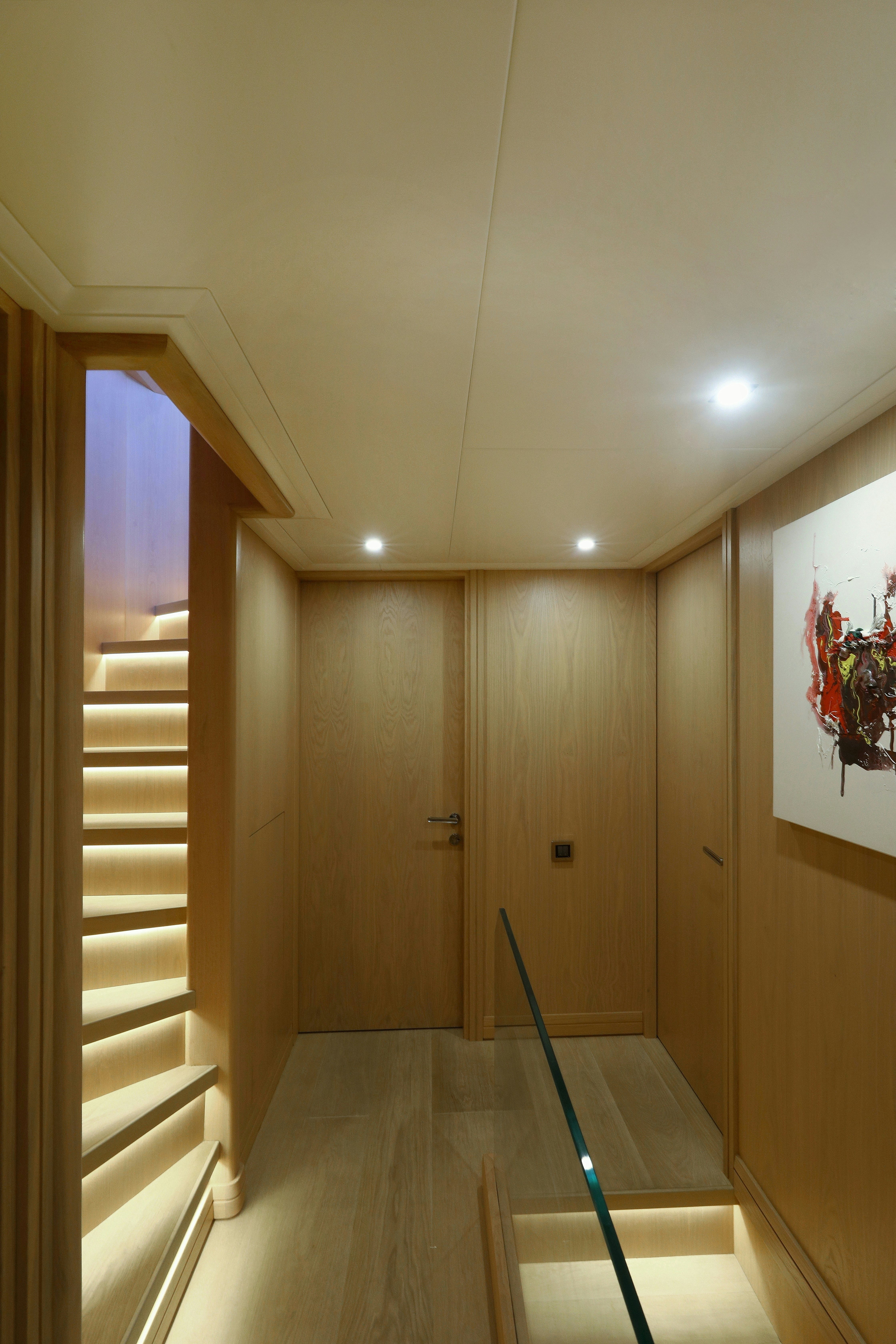 a hallway with a blue railing aboard AEGEAN EXPLORER 26M HULL #3 Yacht for Sale