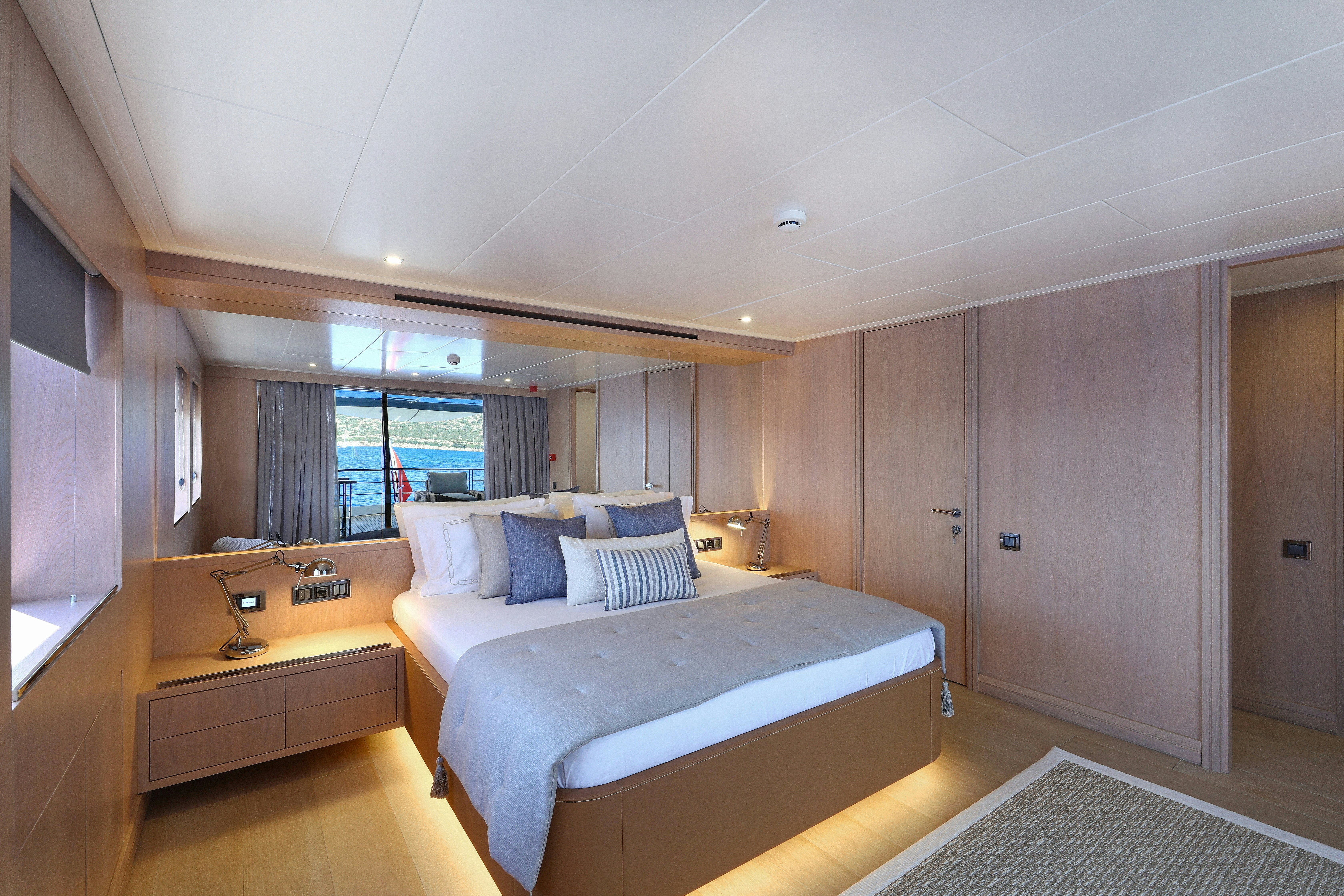 a bedroom with a large bed aboard AEGEAN EXPLORER 26M HULL #3 Yacht for Sale