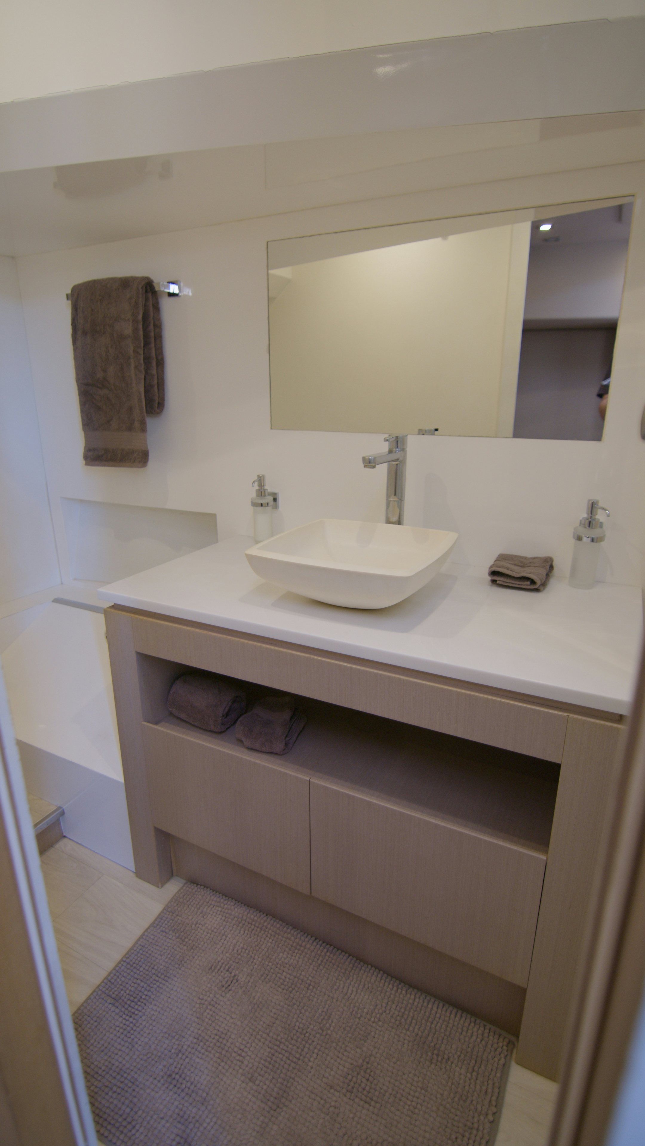 a bathroom with a sink and a mirror aboard QUIKWOOD Yacht for Sale