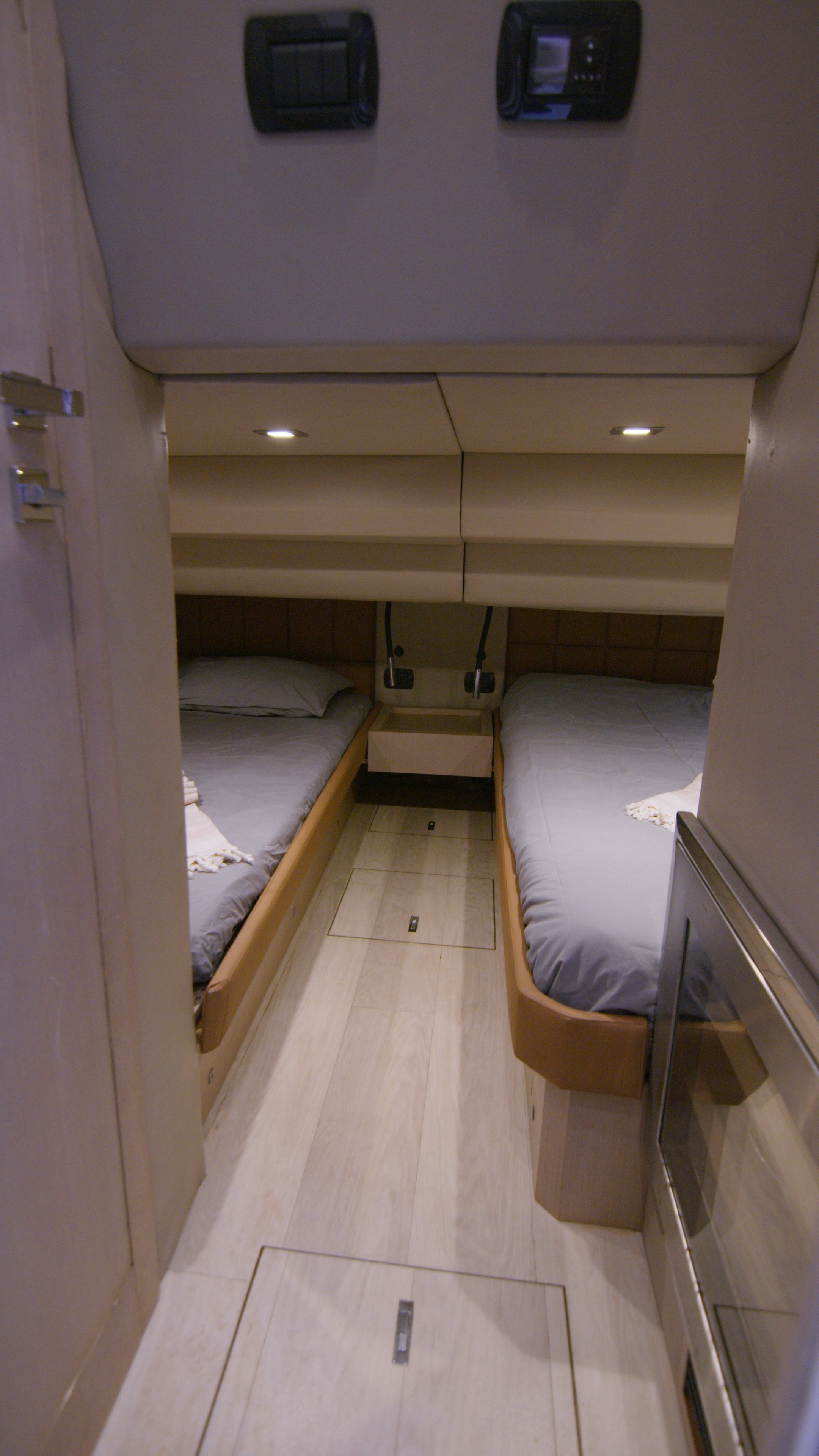 a room with a bed and a mirror aboard QUIKWOOD Yacht for Sale
