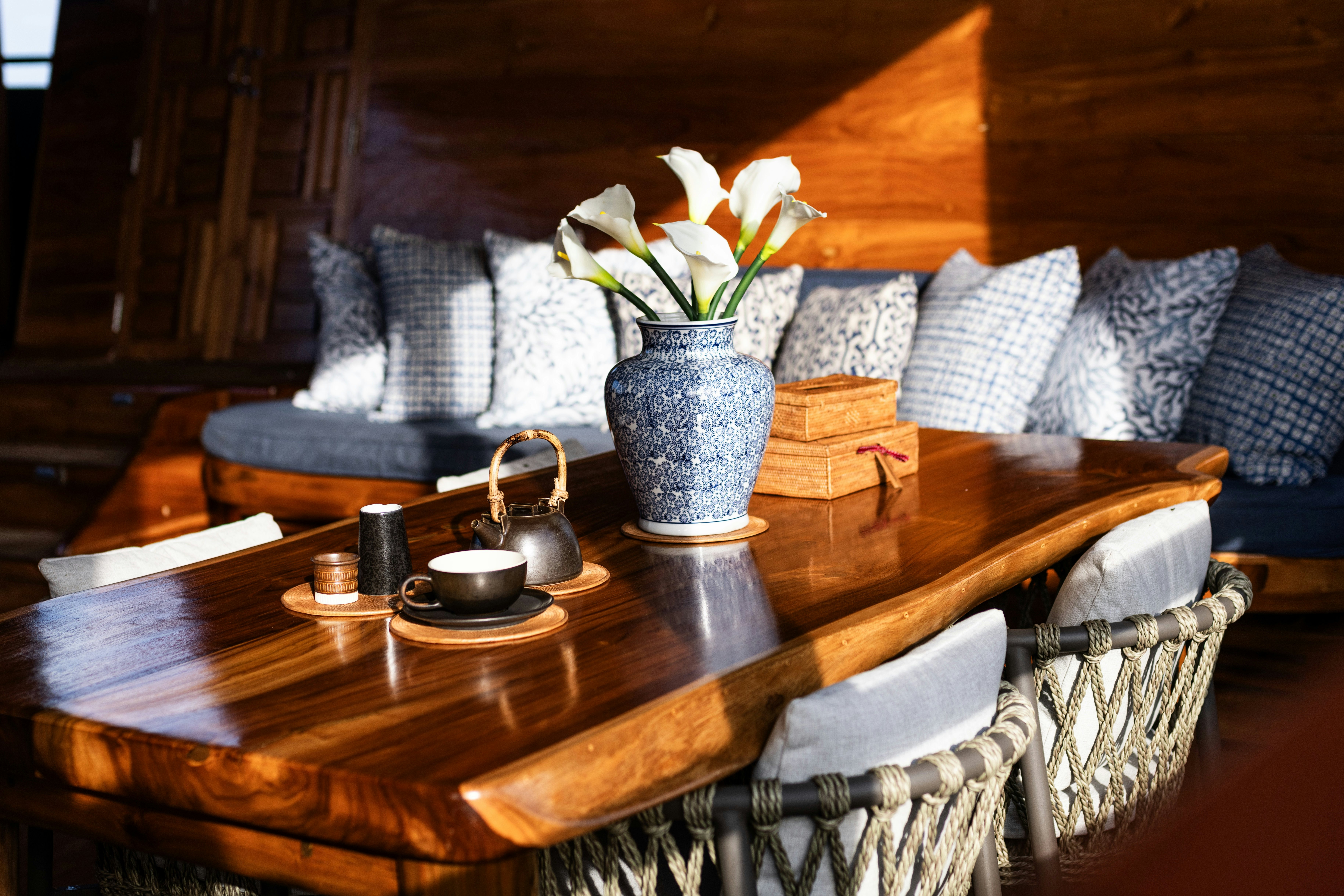 a table with a vase and a flower on it aboard SEQUOIA Yacht for Charter