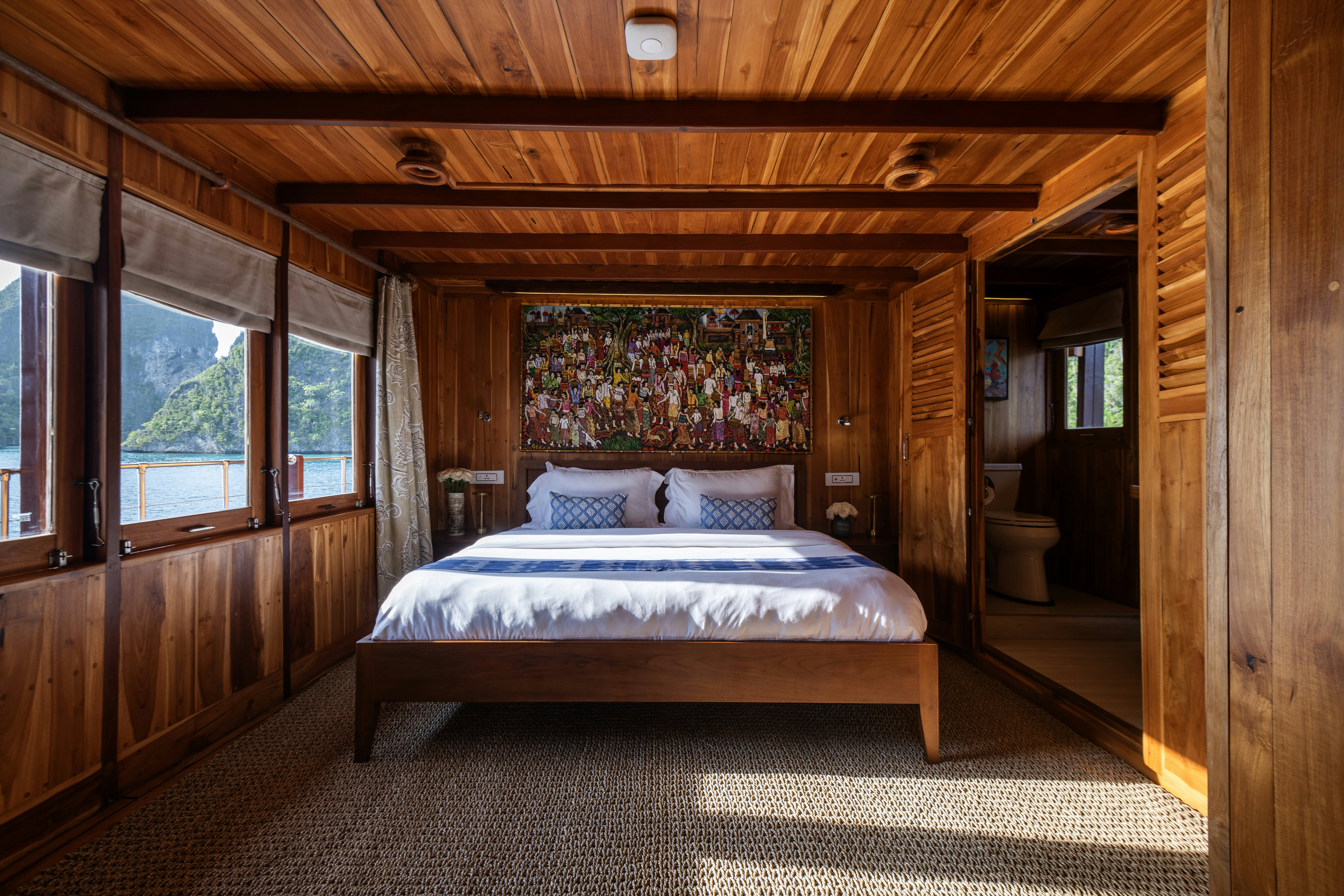 a bed in a room aboard SEQUOIA Yacht for Charter