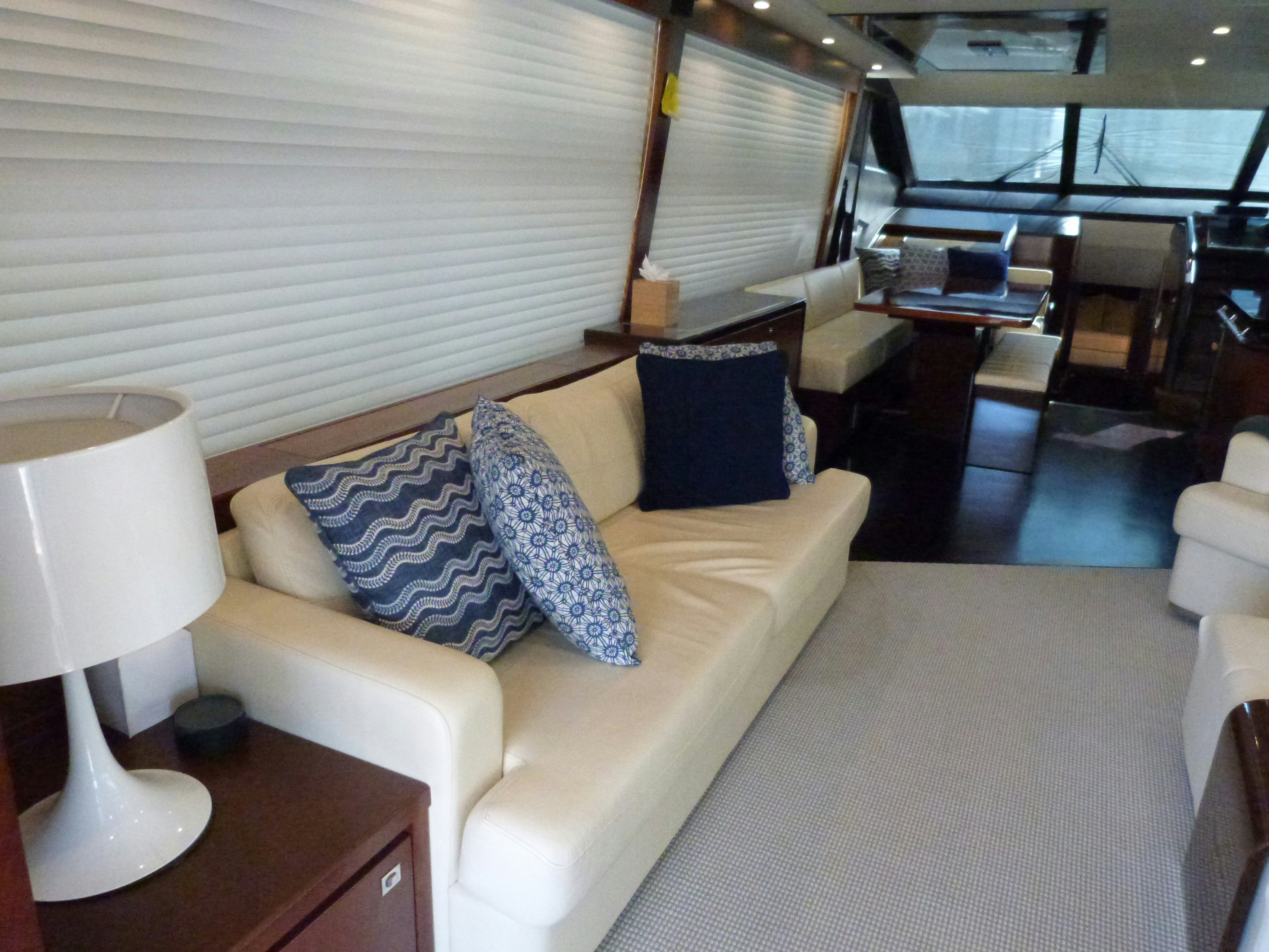 a living room with a couch and a lamp aboard LADY A Yacht for Sale