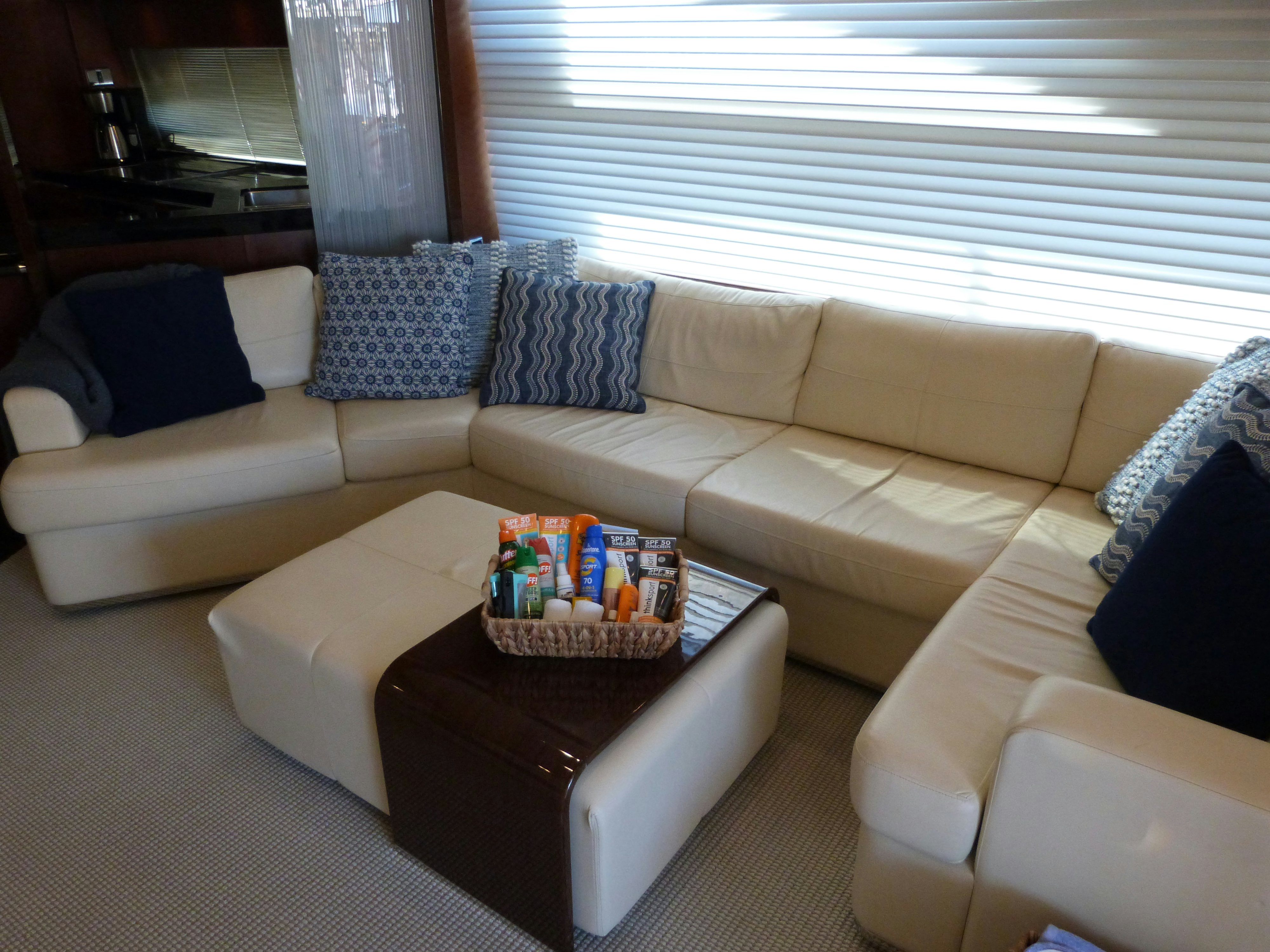 a living room with a couch and a coffee table aboard LADY A Yacht for Sale