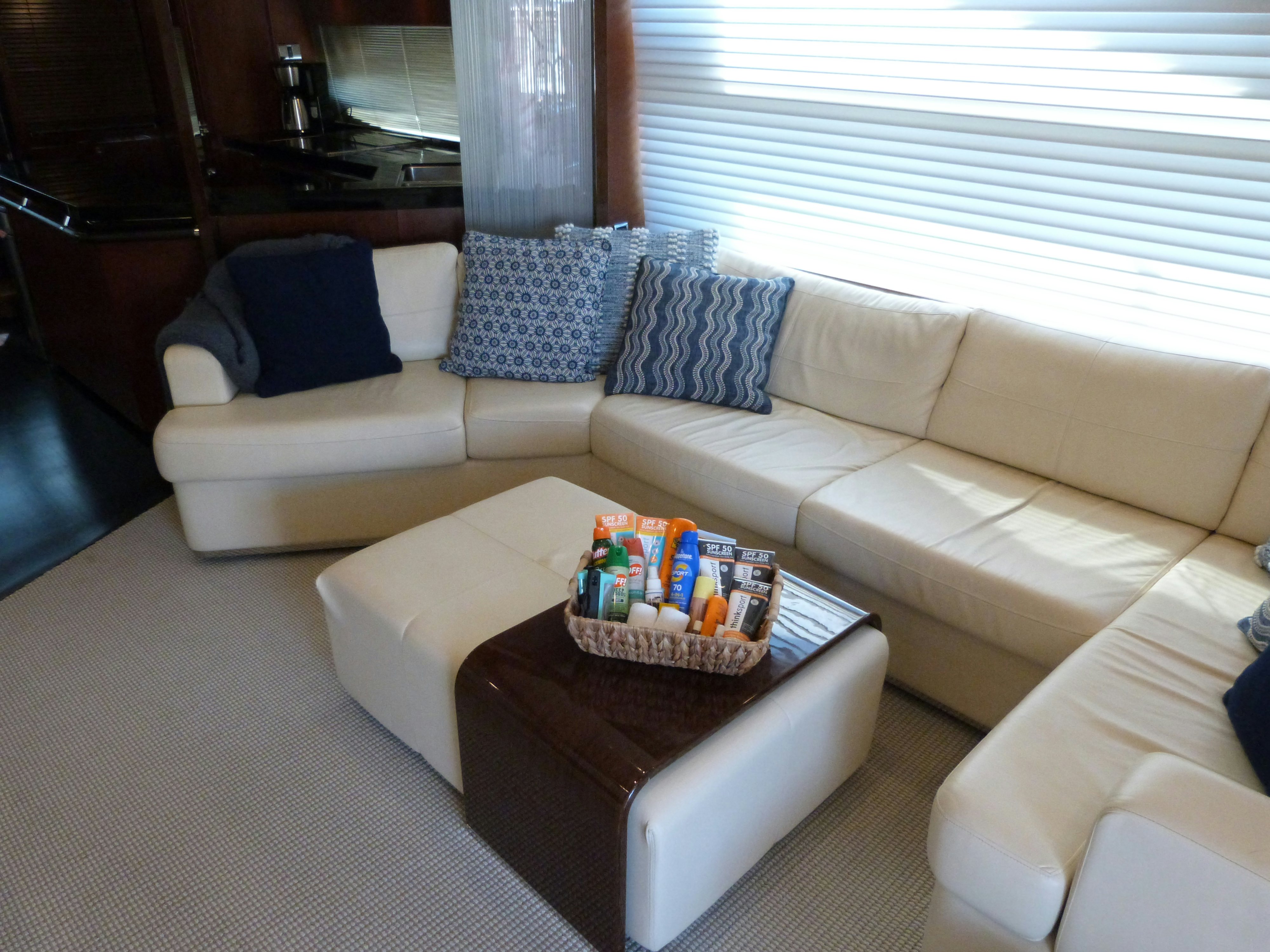 a living room with a couch and a coffee table aboard LADY A Yacht for Sale