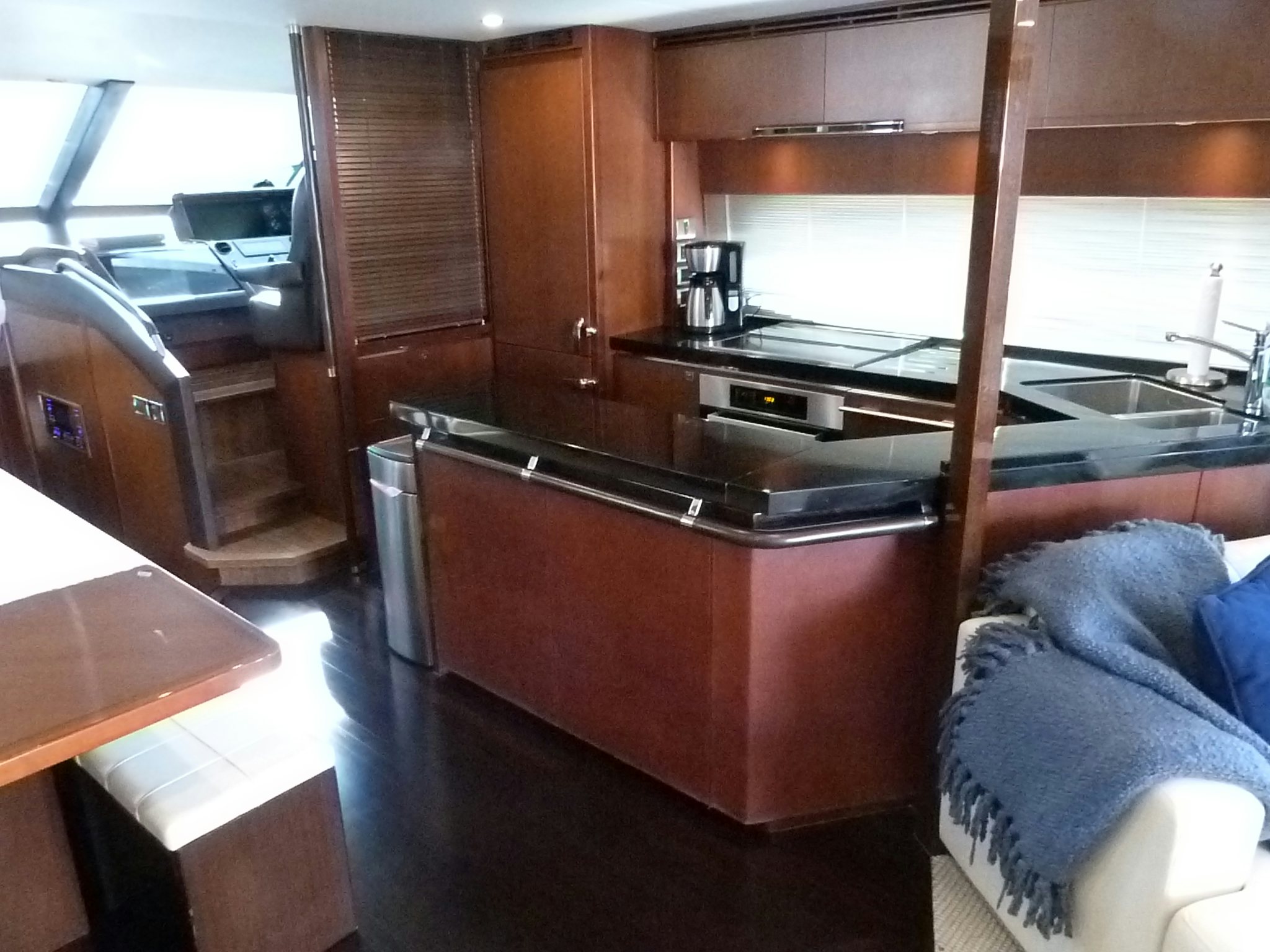 a kitchen with a large wooden cabinet aboard LADY A Yacht for Sale