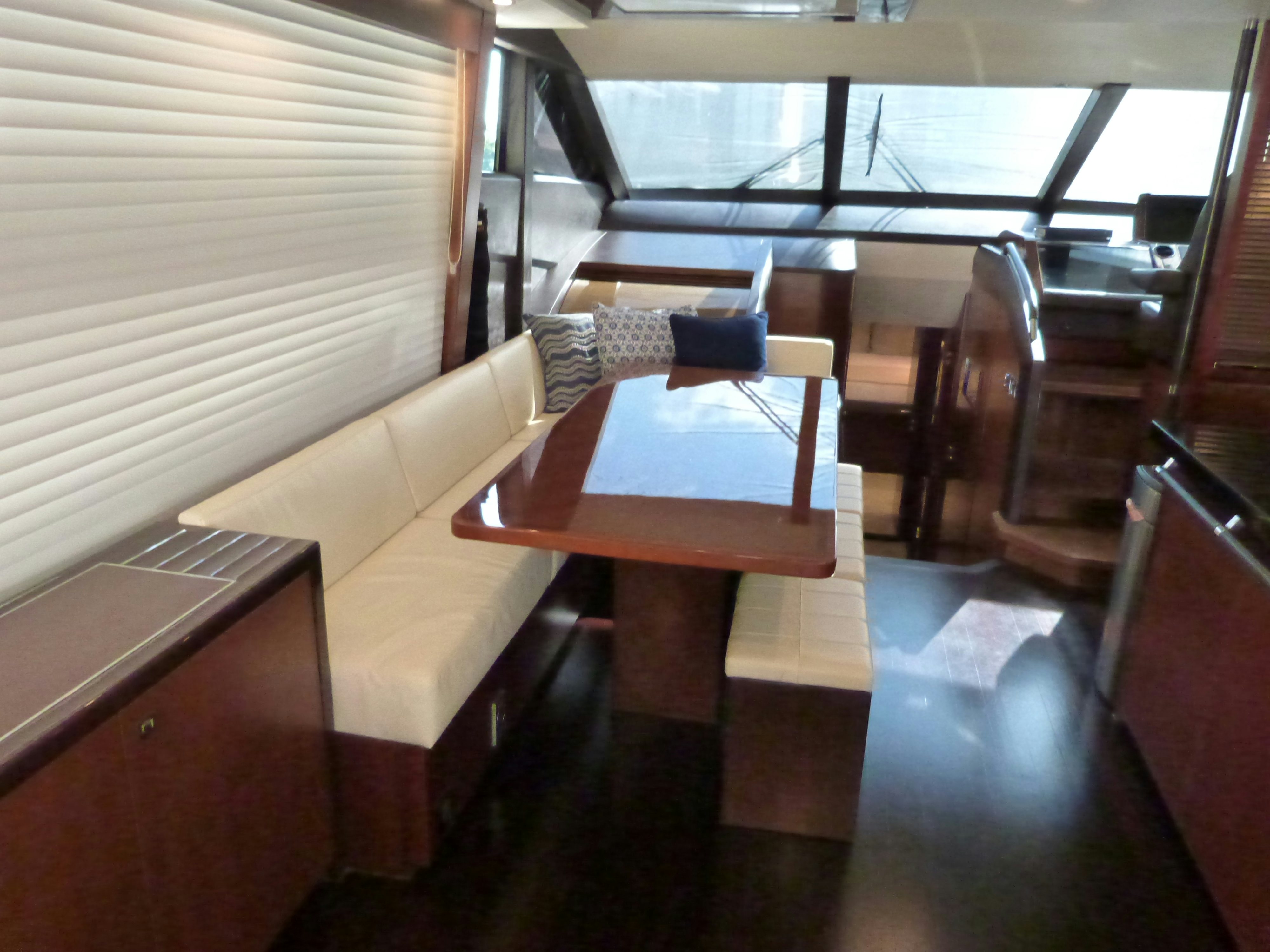 a table and chairs in a room aboard LADY A Yacht for Sale