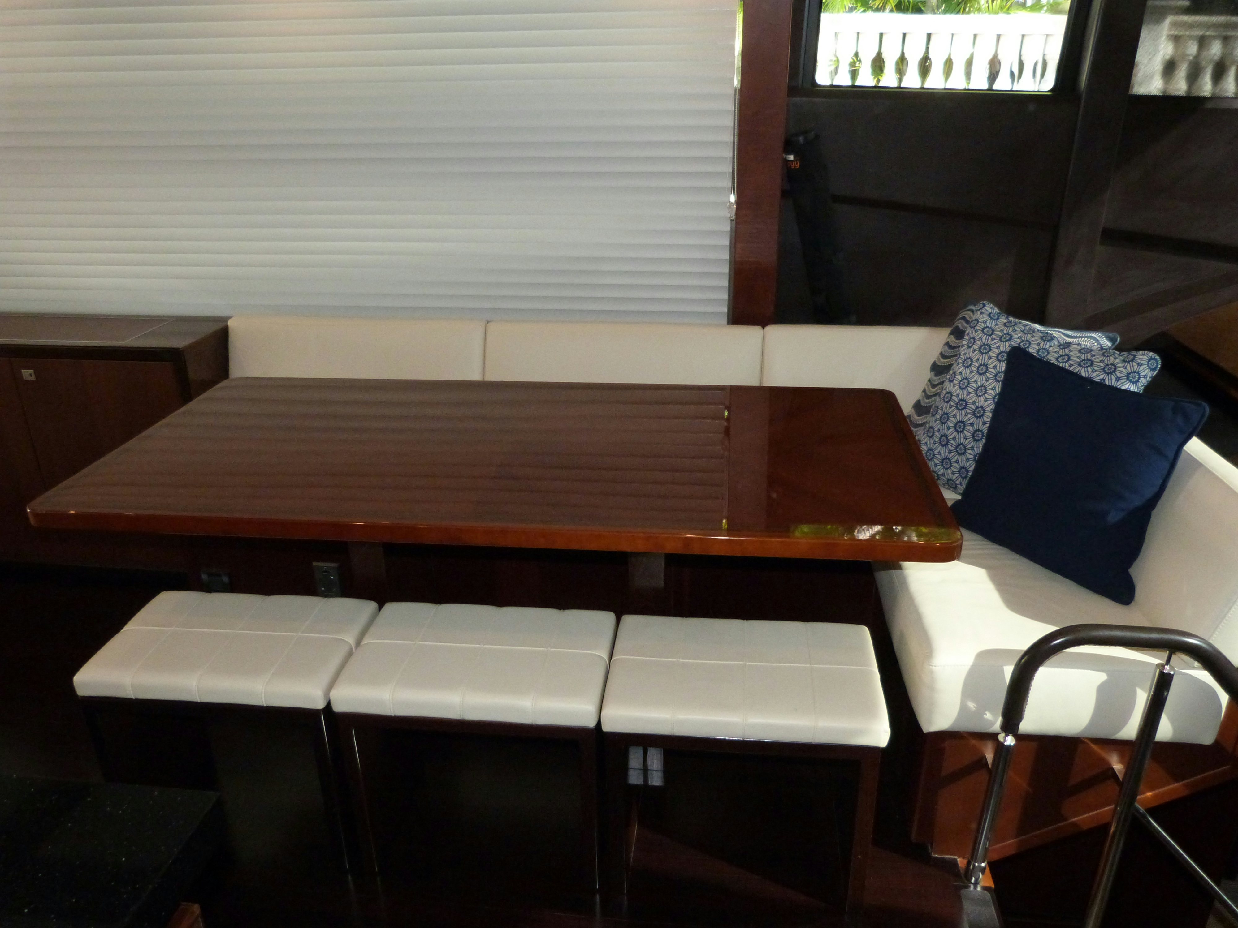a wooden table with chairs aboard LADY A Yacht for Sale