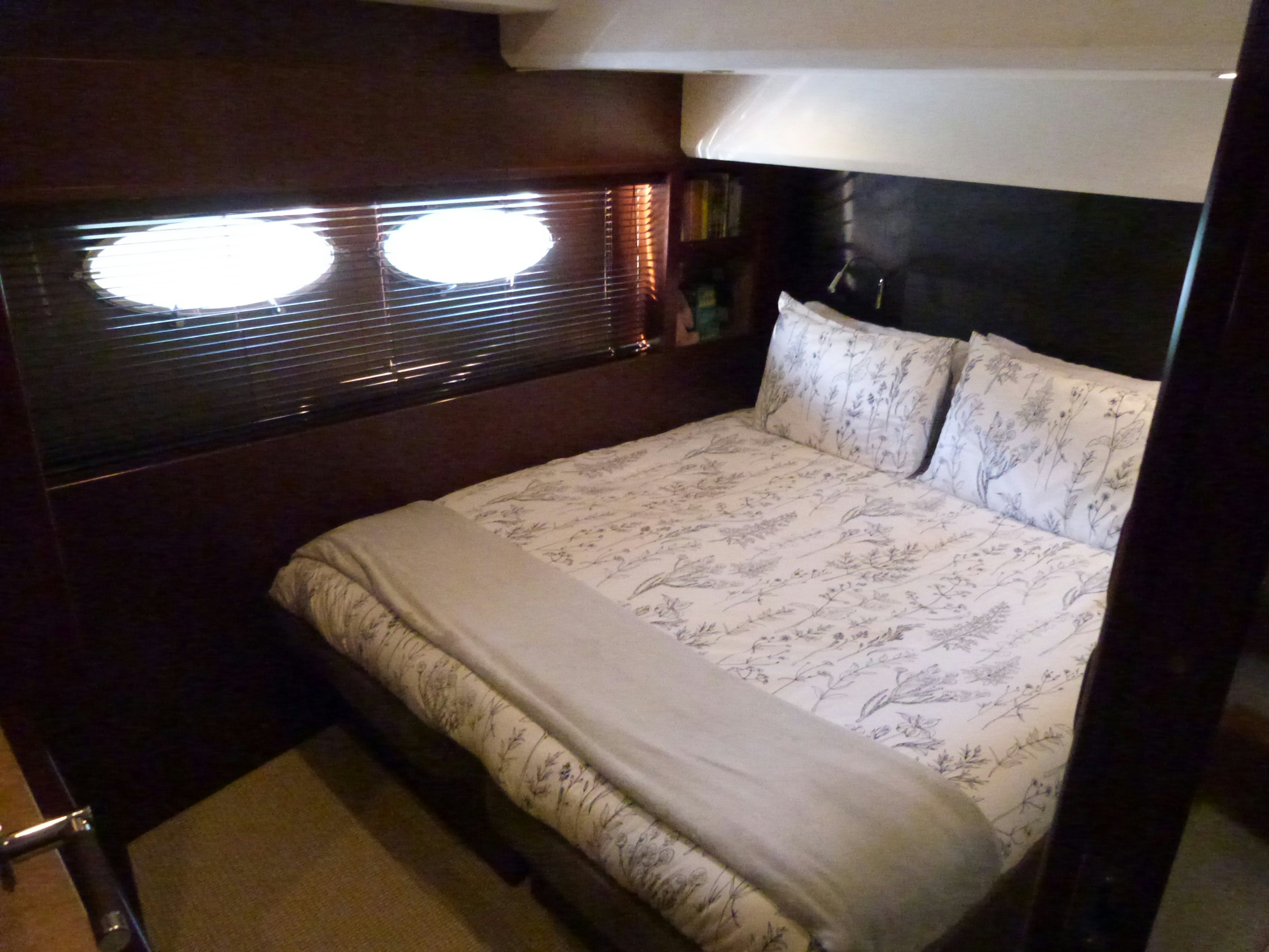 a bed with white sheets aboard LADY A Yacht for Sale