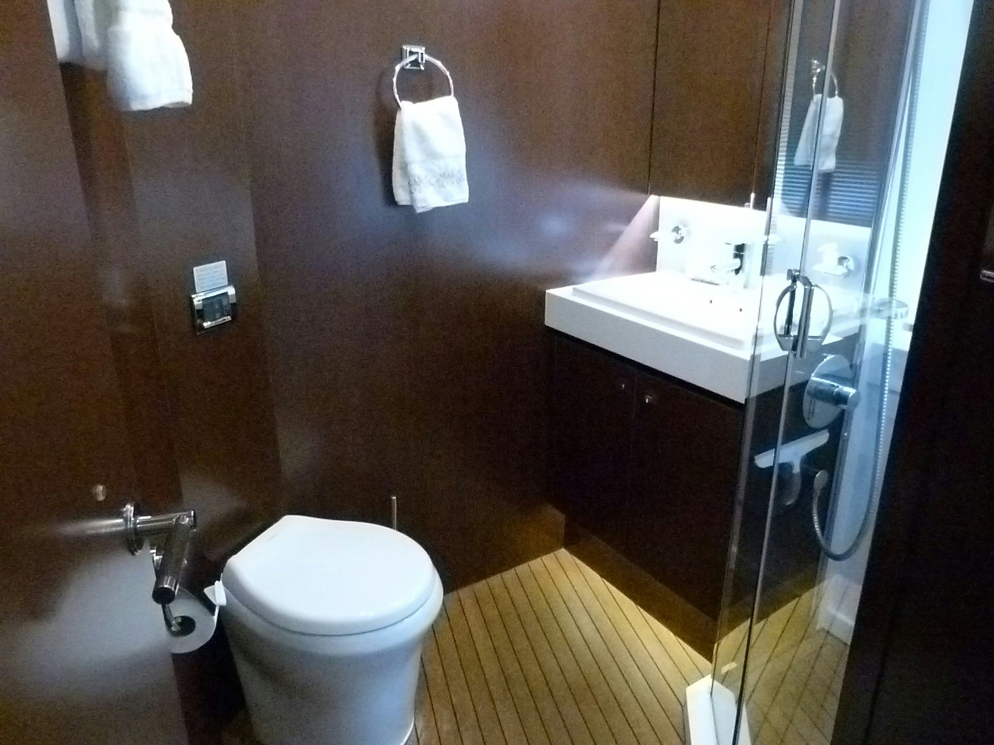 a bathroom with a toilet and sink aboard LADY A Yacht for Sale