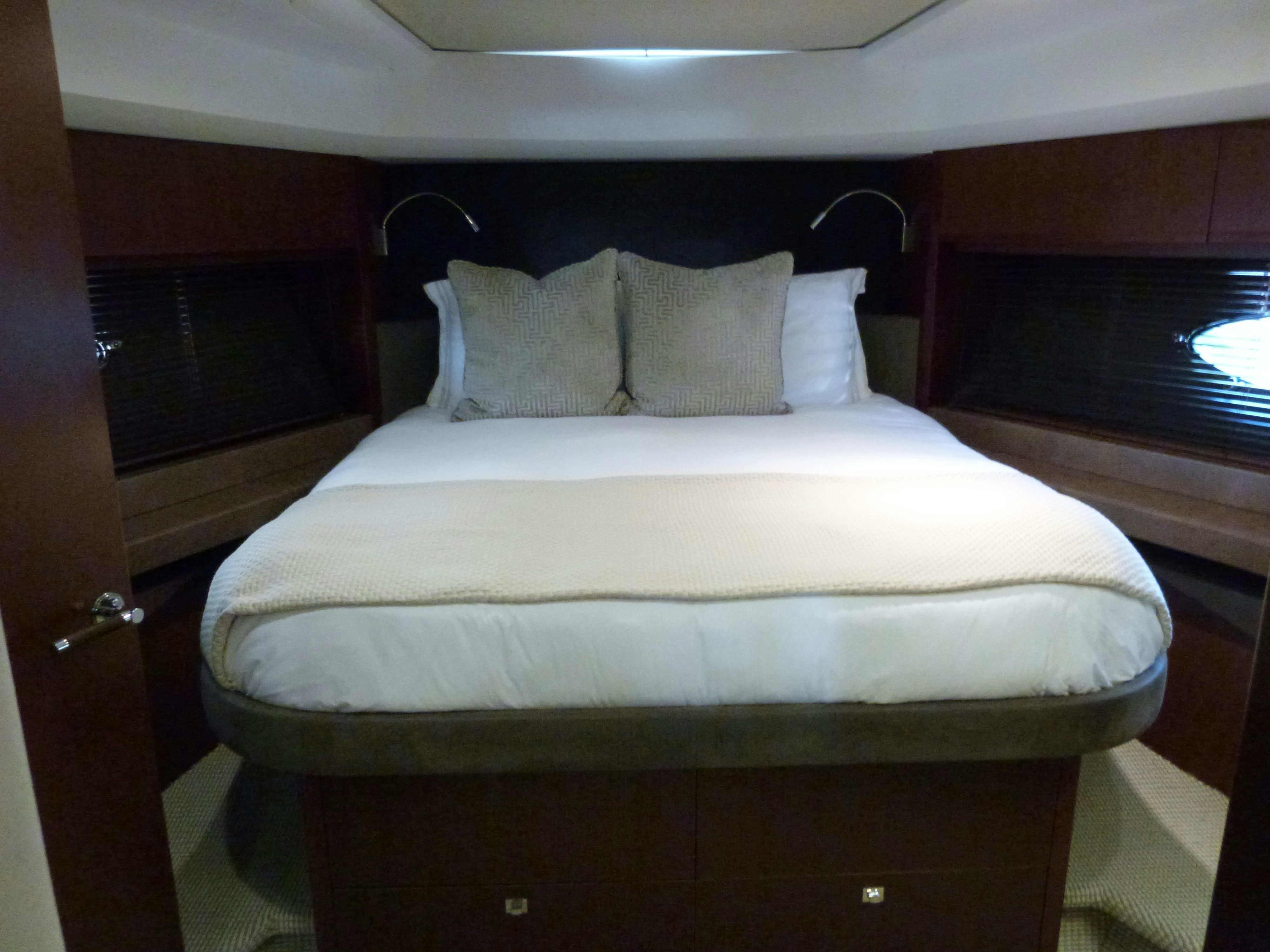a bed with white sheets aboard LADY A Yacht for Sale