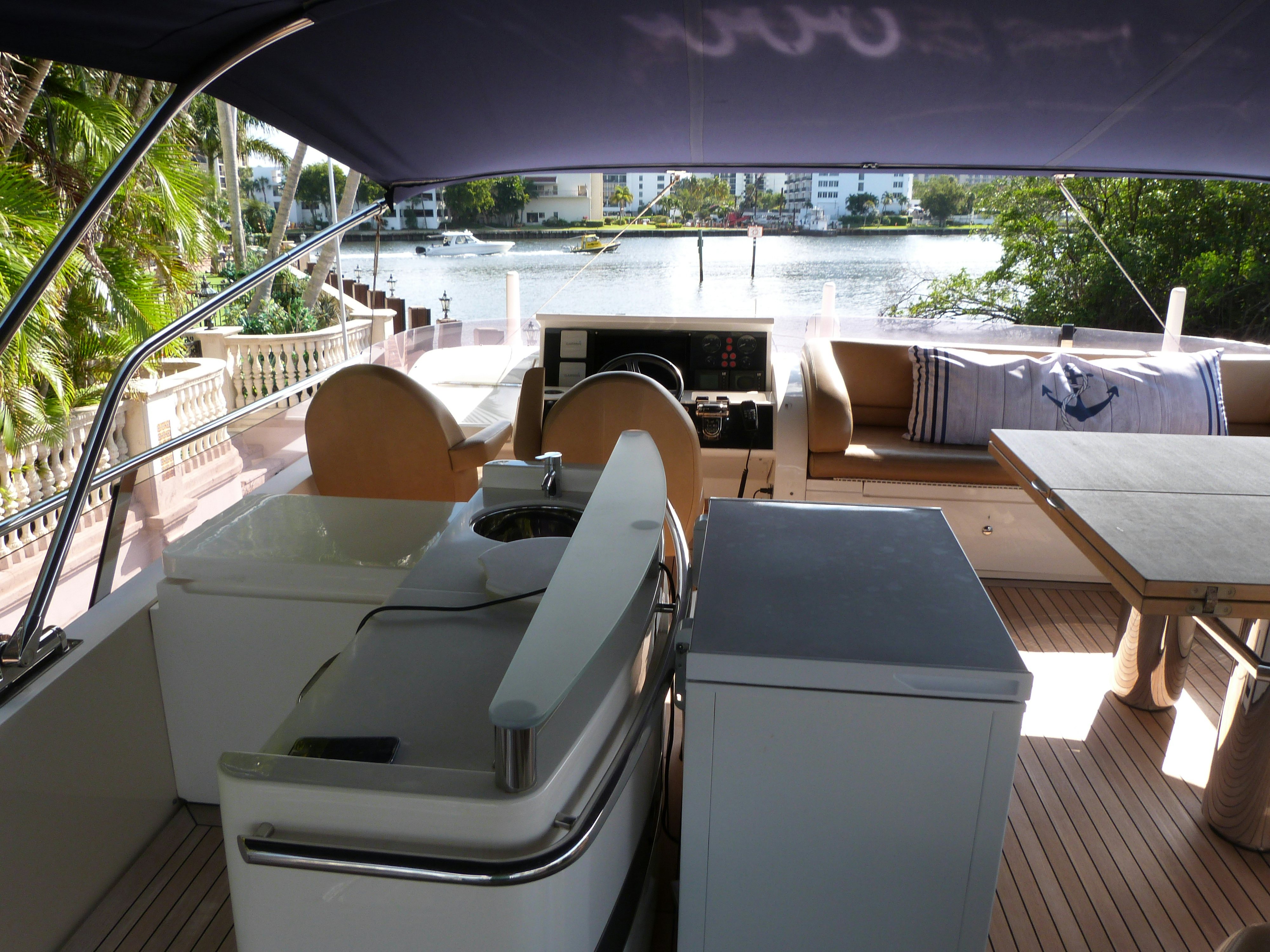 a room with a table chairs and a large body of water aboard LADY A Yacht for Sale