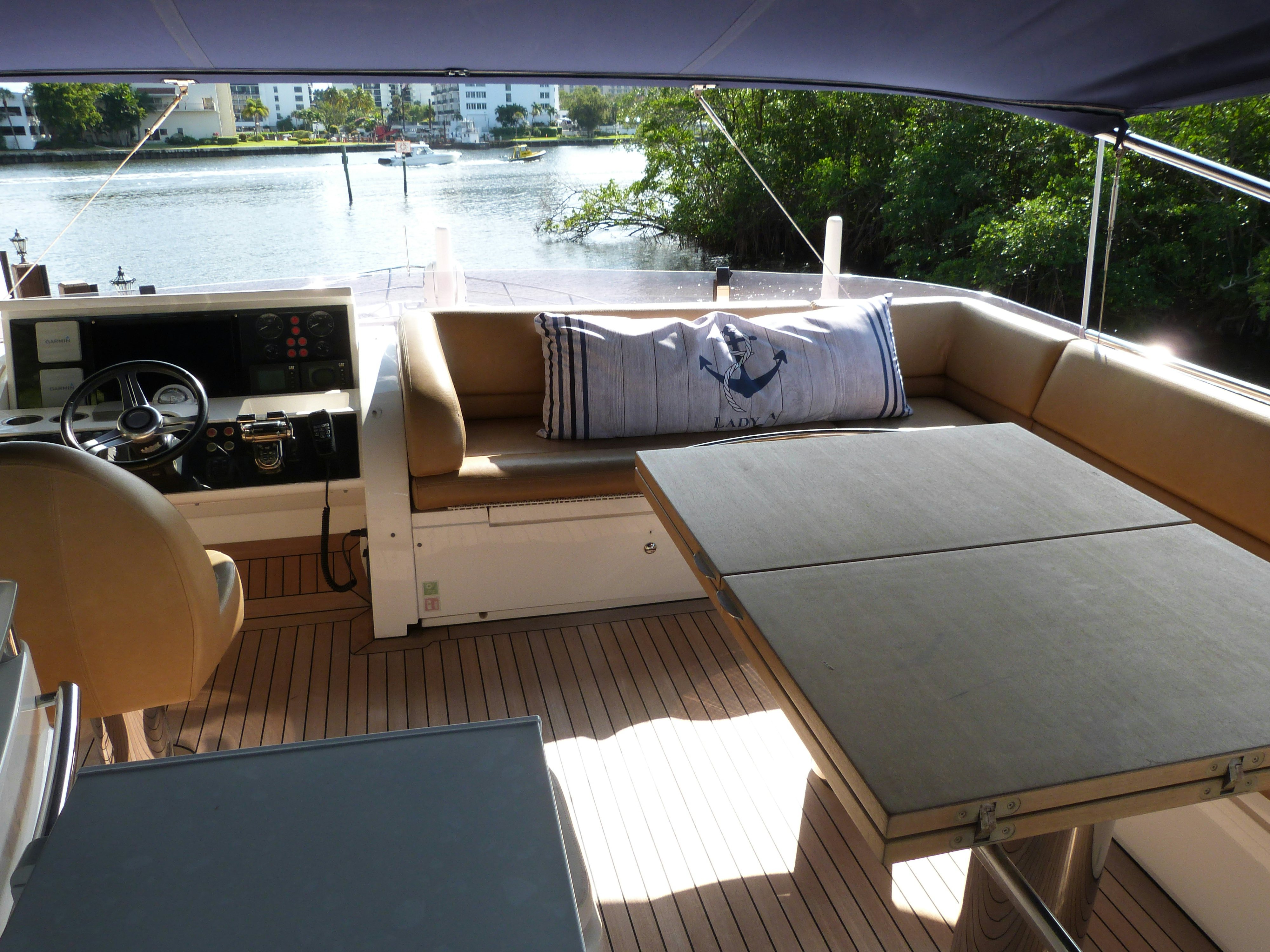 a living room with a couch and a pool aboard LADY A Yacht for Sale