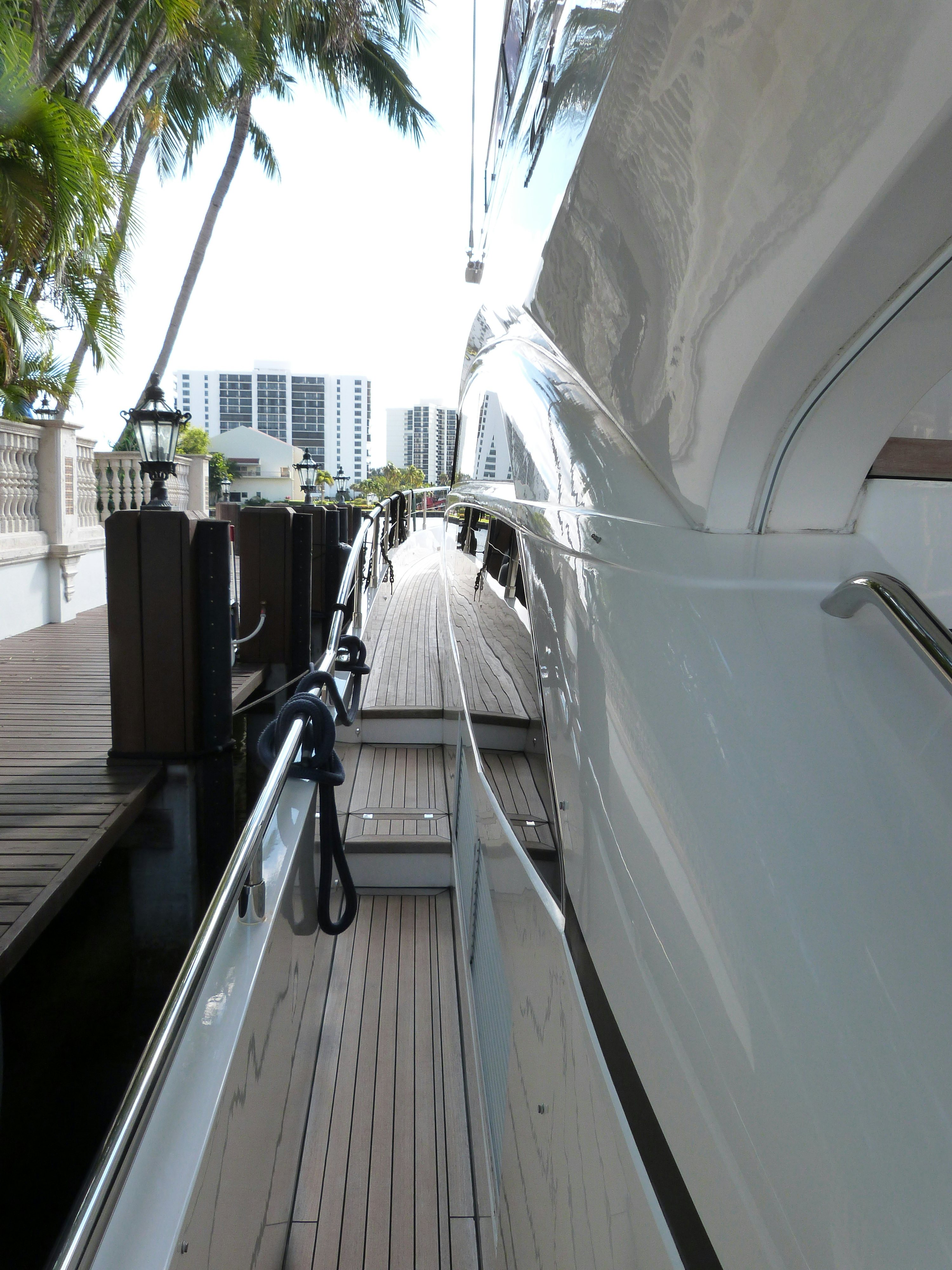 a white boat with a black object on it aboard LADY A Yacht for Sale