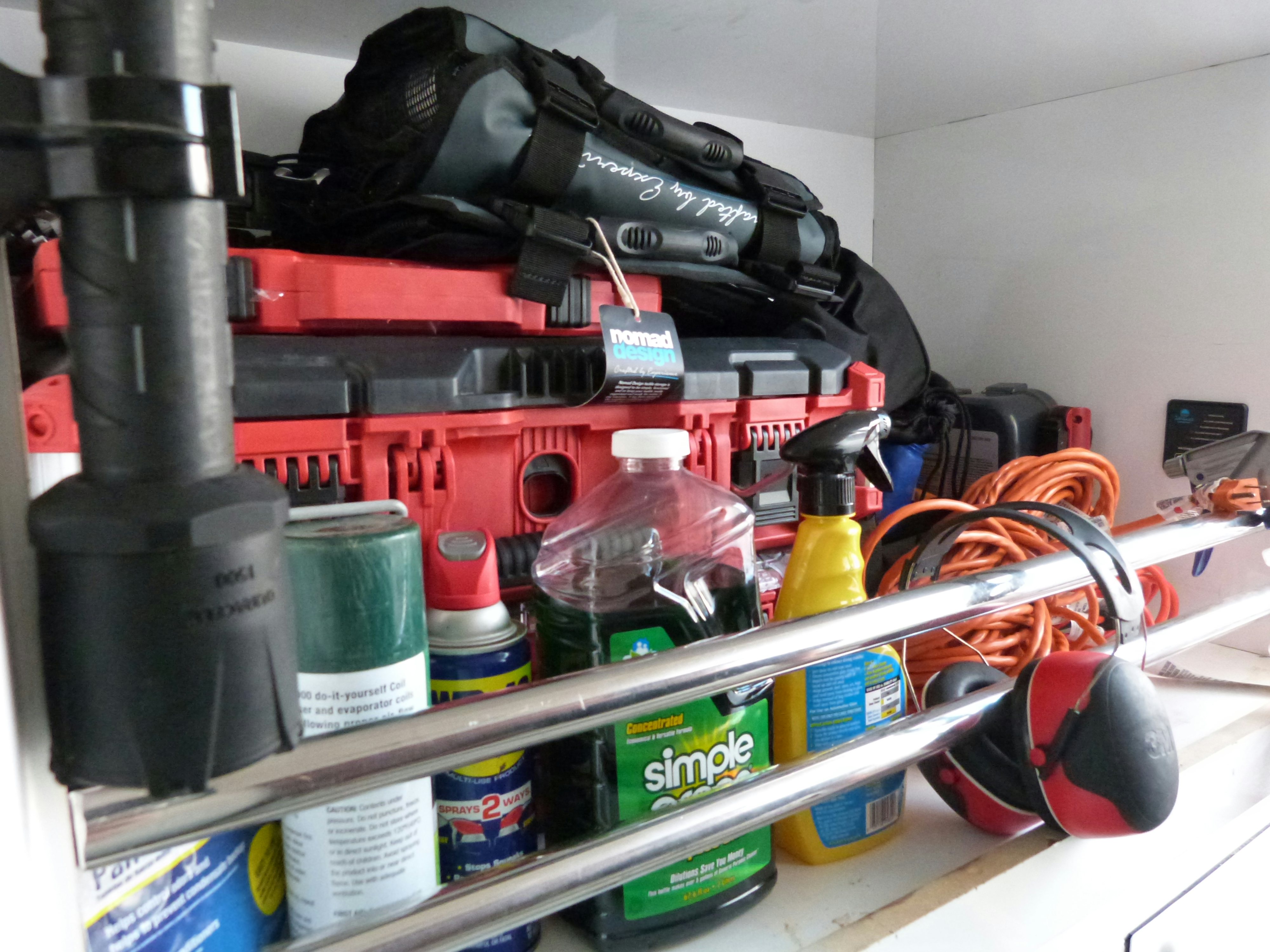 a shelf with bottles and cans aboard LADY A Yacht for Sale