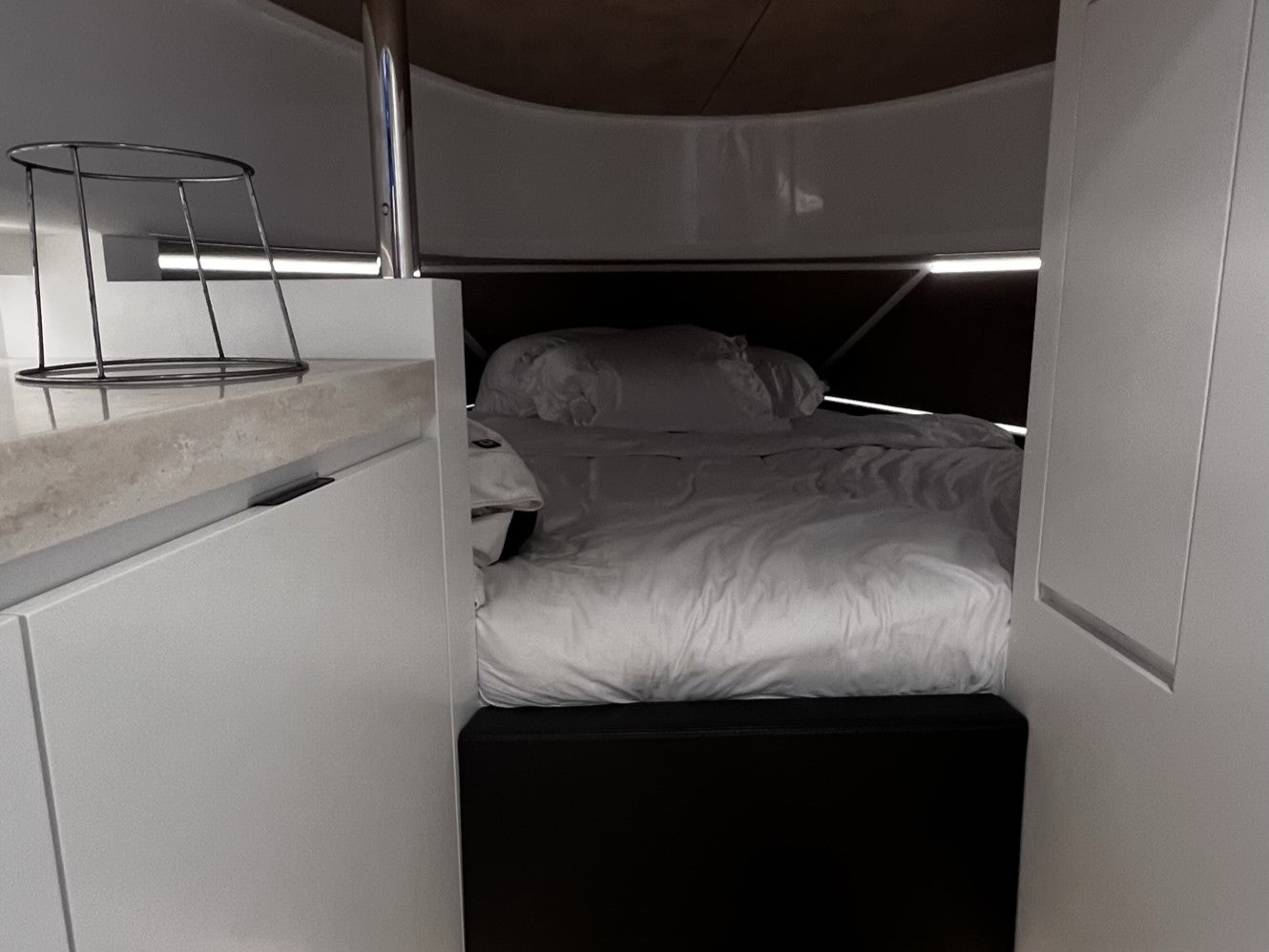a small bed in a small room aboard MONEYPENNY Yacht for Sale