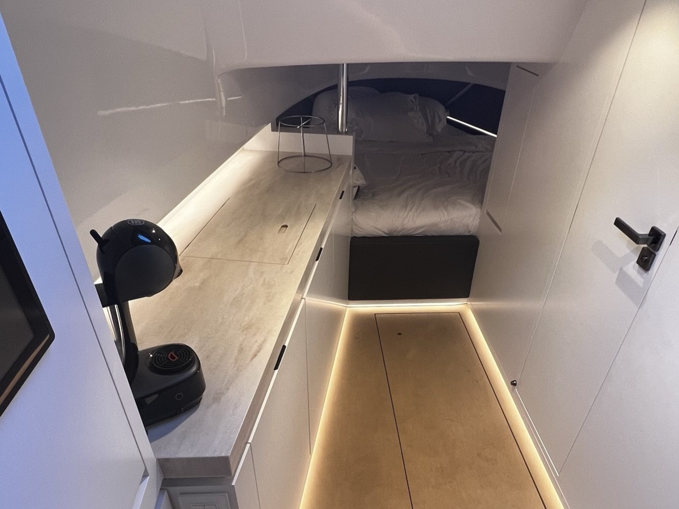 a room with a bed and a desk aboard MONEYPENNY Yacht for Sale