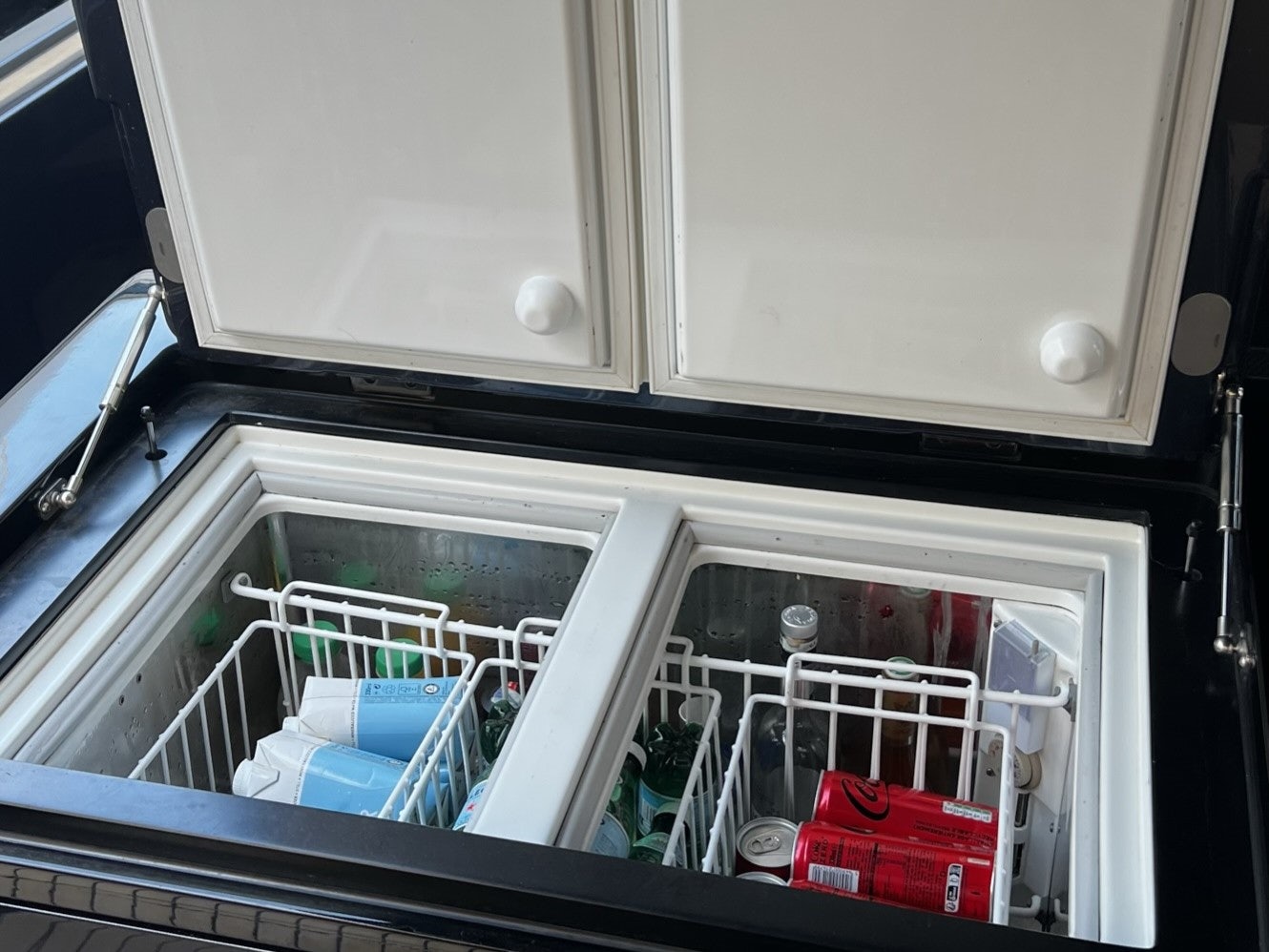 a dishwasher with a door open aboard MONEYPENNY Yacht for Sale