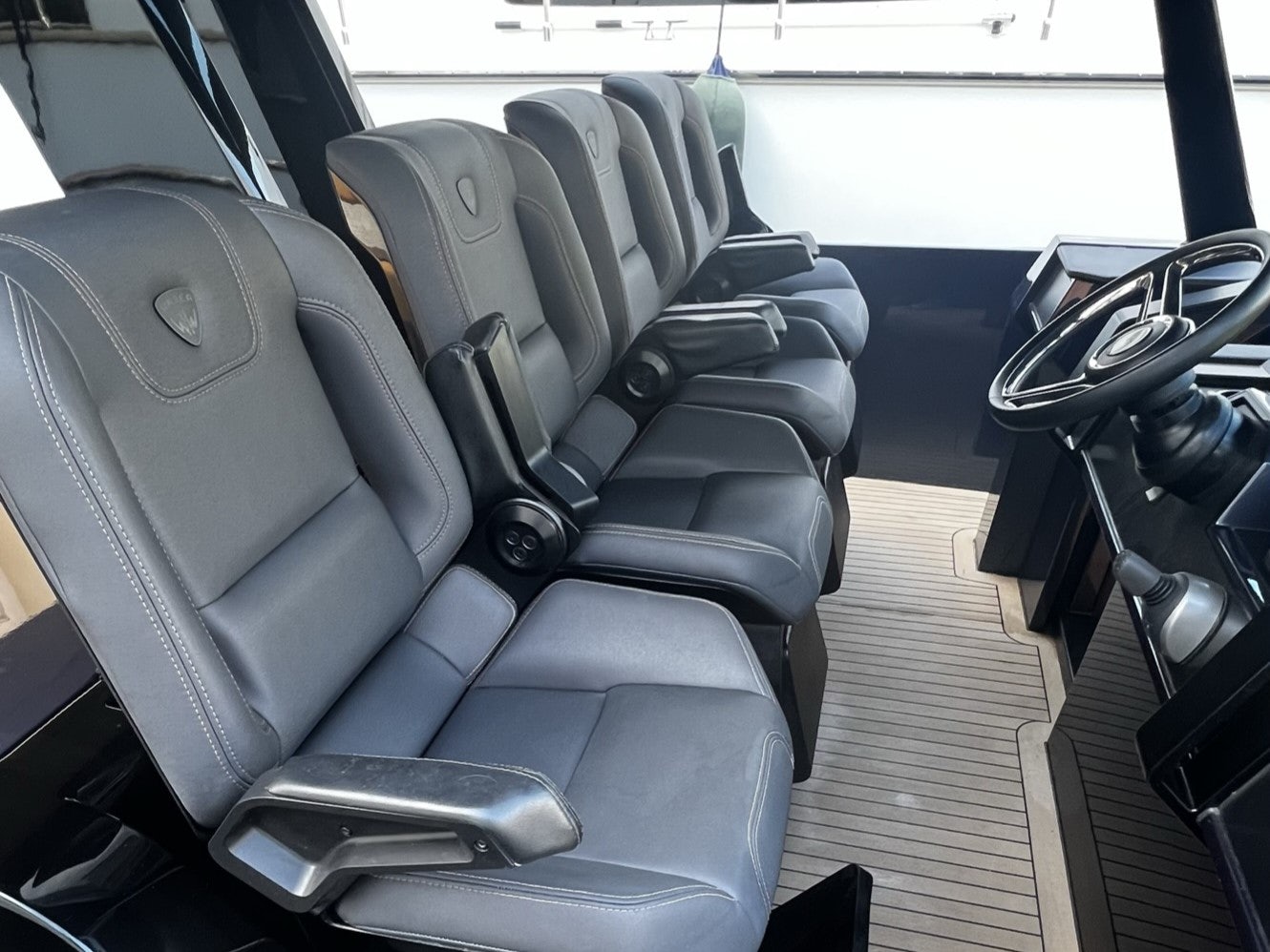 a group of seats in a bus aboard MONEYPENNY Yacht for Sale