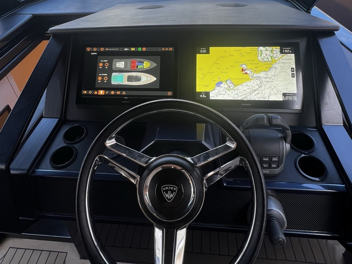 a steering wheel and dashboard of a car aboard MONEYPENNY Yacht for Sale