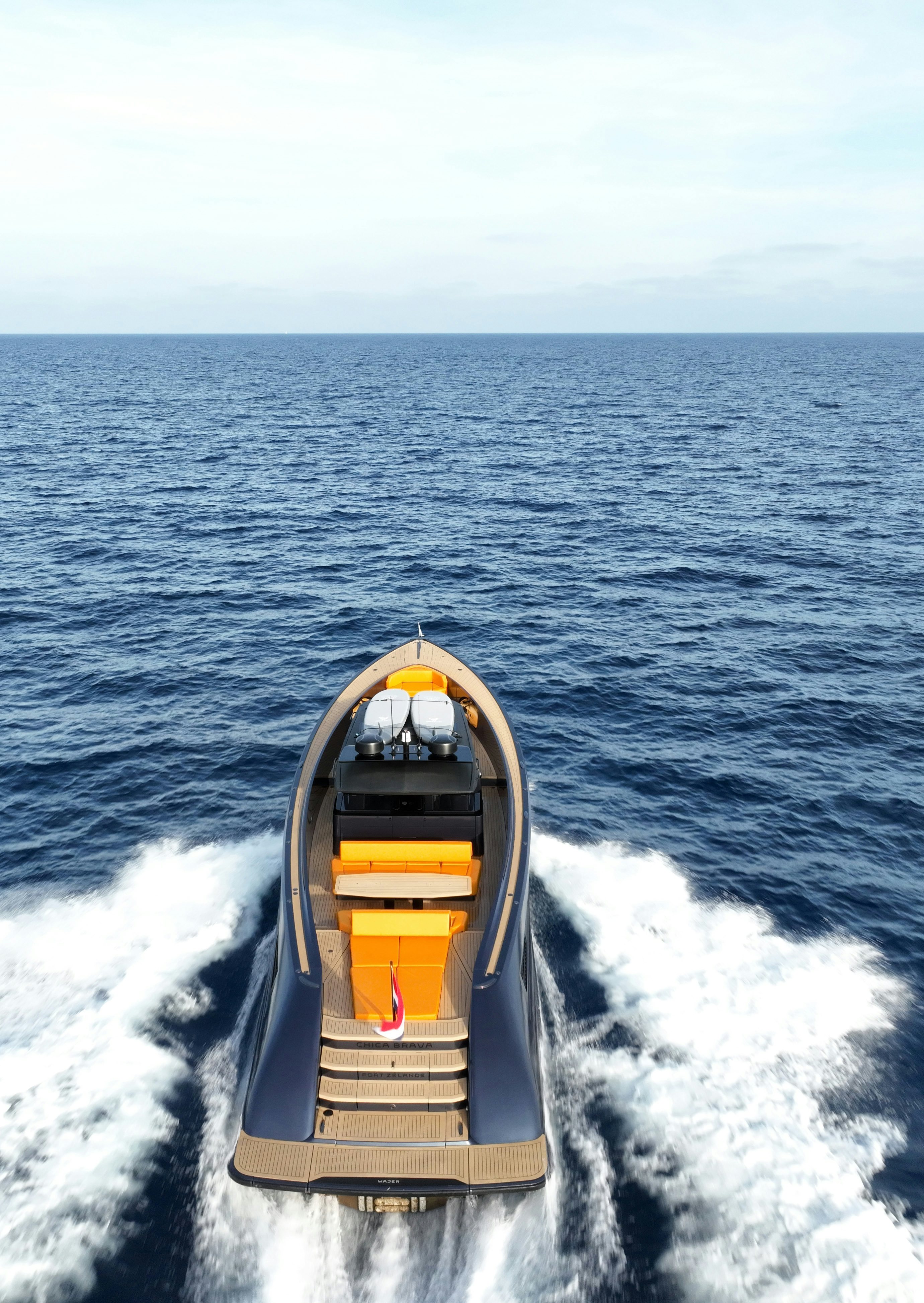 a speed boat on the water aboard MONEYPENNY Yacht for Sale