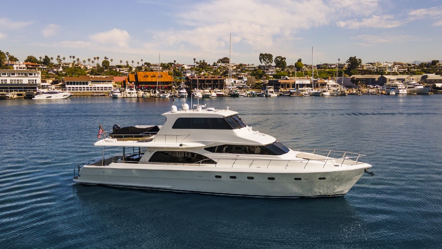 a white yacht in the water aboard PORK CHOP Yacht for Sale