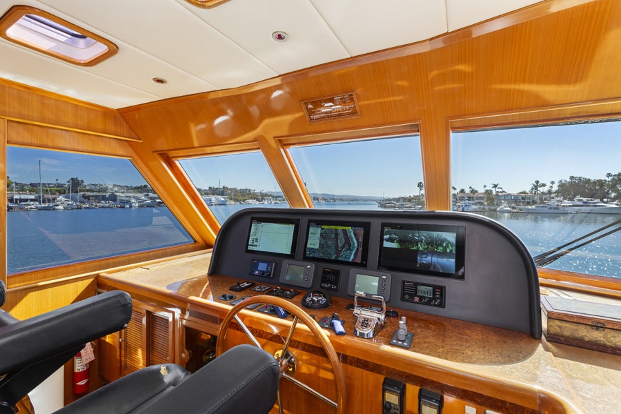 inside of a vehicle with a large window and a view of the water aboard PORK CHOP Yacht for Sale