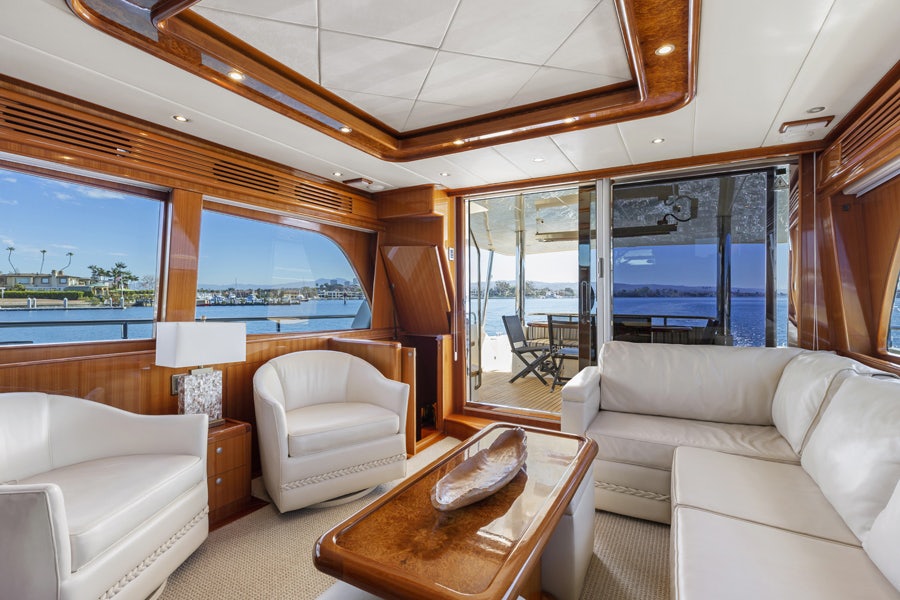a living room with a large window aboard PORK CHOP Yacht for Sale