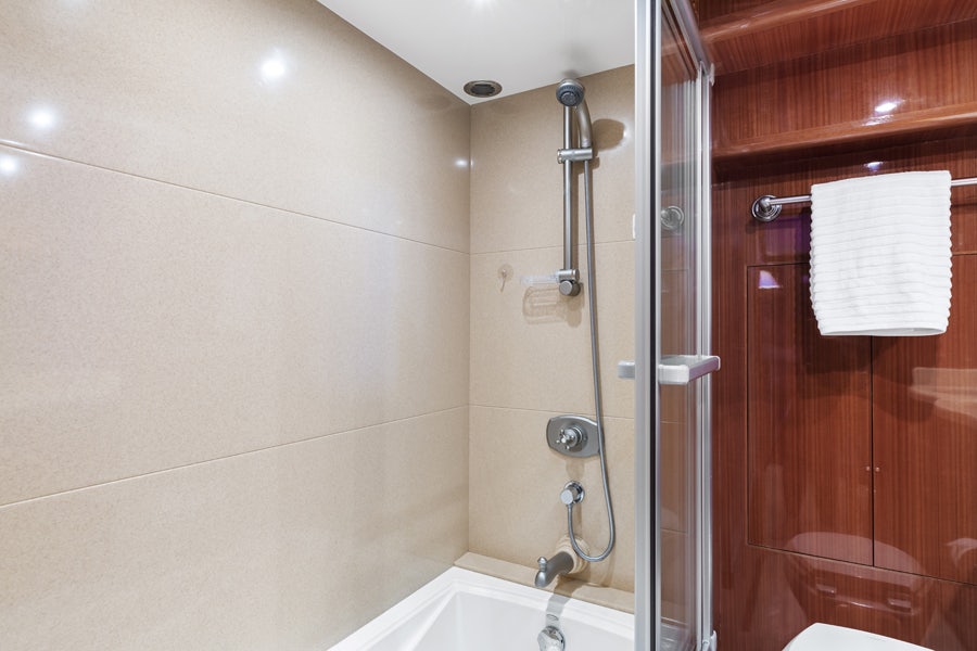 a bathroom with a shower and sink aboard PORK CHOP Yacht for Sale