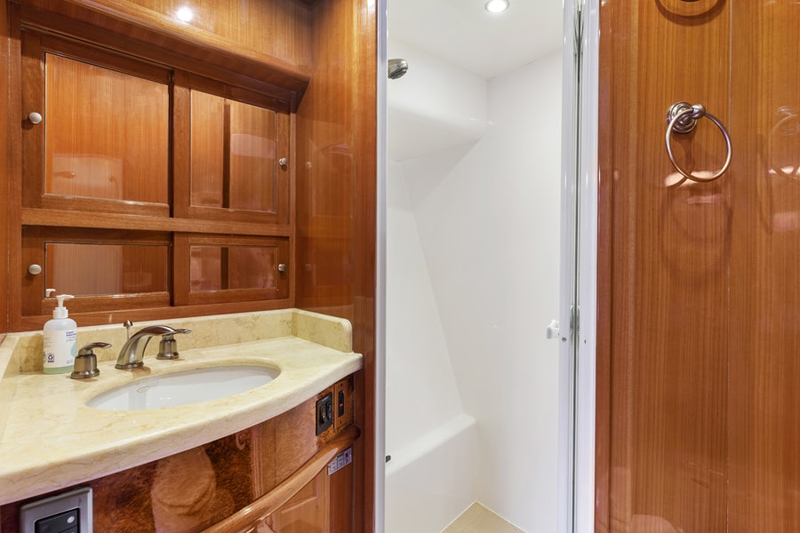 a bathroom with a sink and cabinets aboard PORK CHOP Yacht for Sale