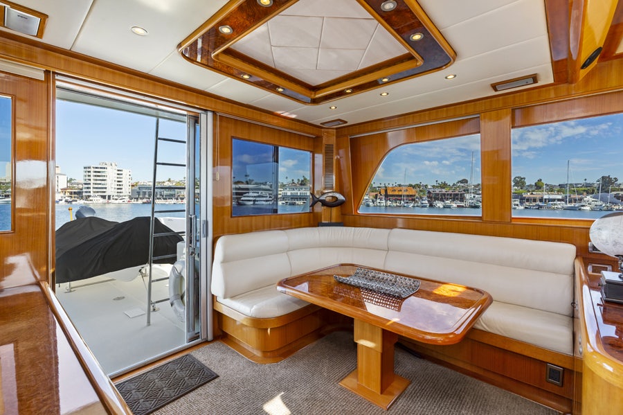 a living room with a large glass door aboard PORK CHOP Yacht for Sale