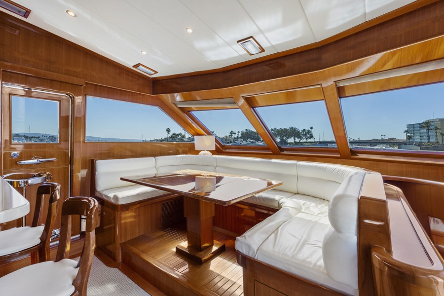 a room with a table and chairs aboard PORK CHOP Yacht for Sale