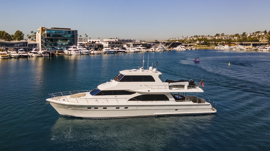 a white yacht in the water aboard PORK CHOP Yacht for Sale
