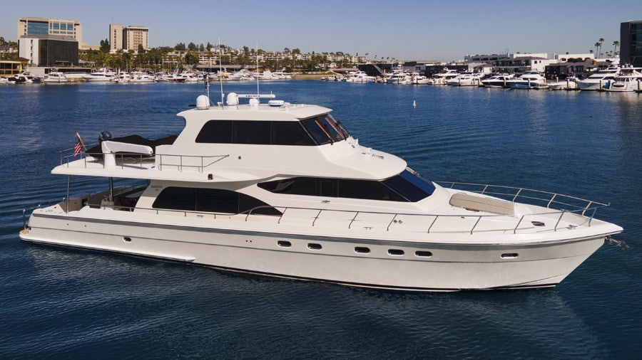 a white yacht in the water aboard PORK CHOP Yacht for Sale