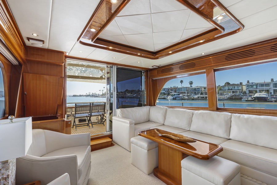 a living room with a large window aboard PORK CHOP Yacht for Sale