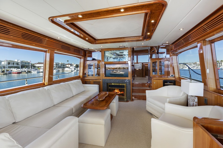 a living room with a large window aboard PORK CHOP Yacht for Sale