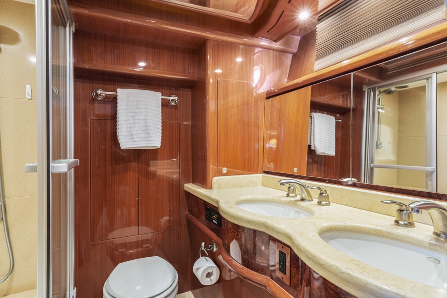 a bathroom with a sink and a toilet aboard PORK CHOP Yacht for Sale