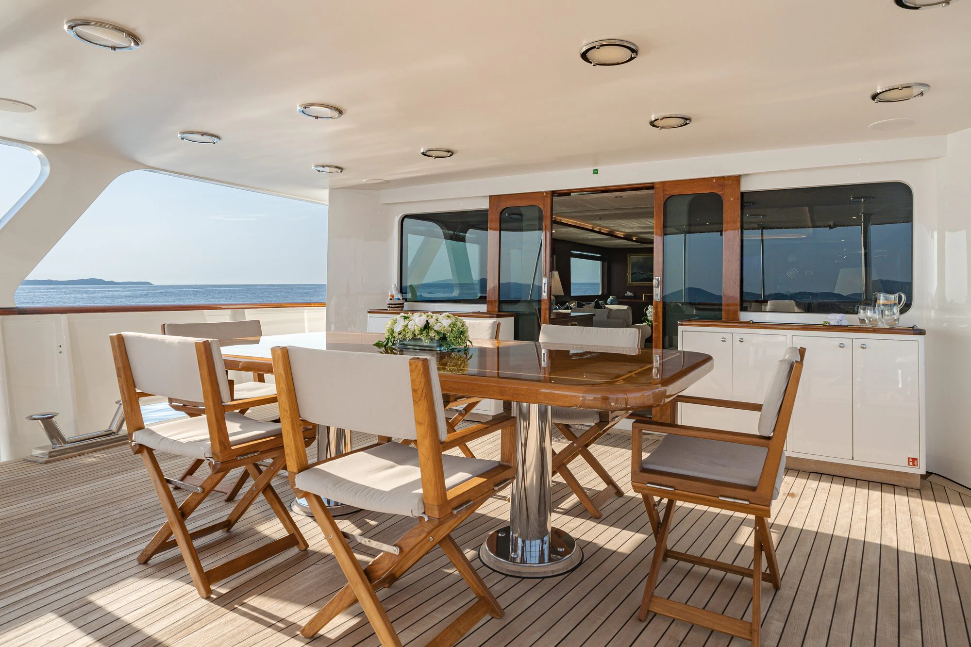 a kitchen with a table and chairs aboard ARIONAS Yacht for Charter