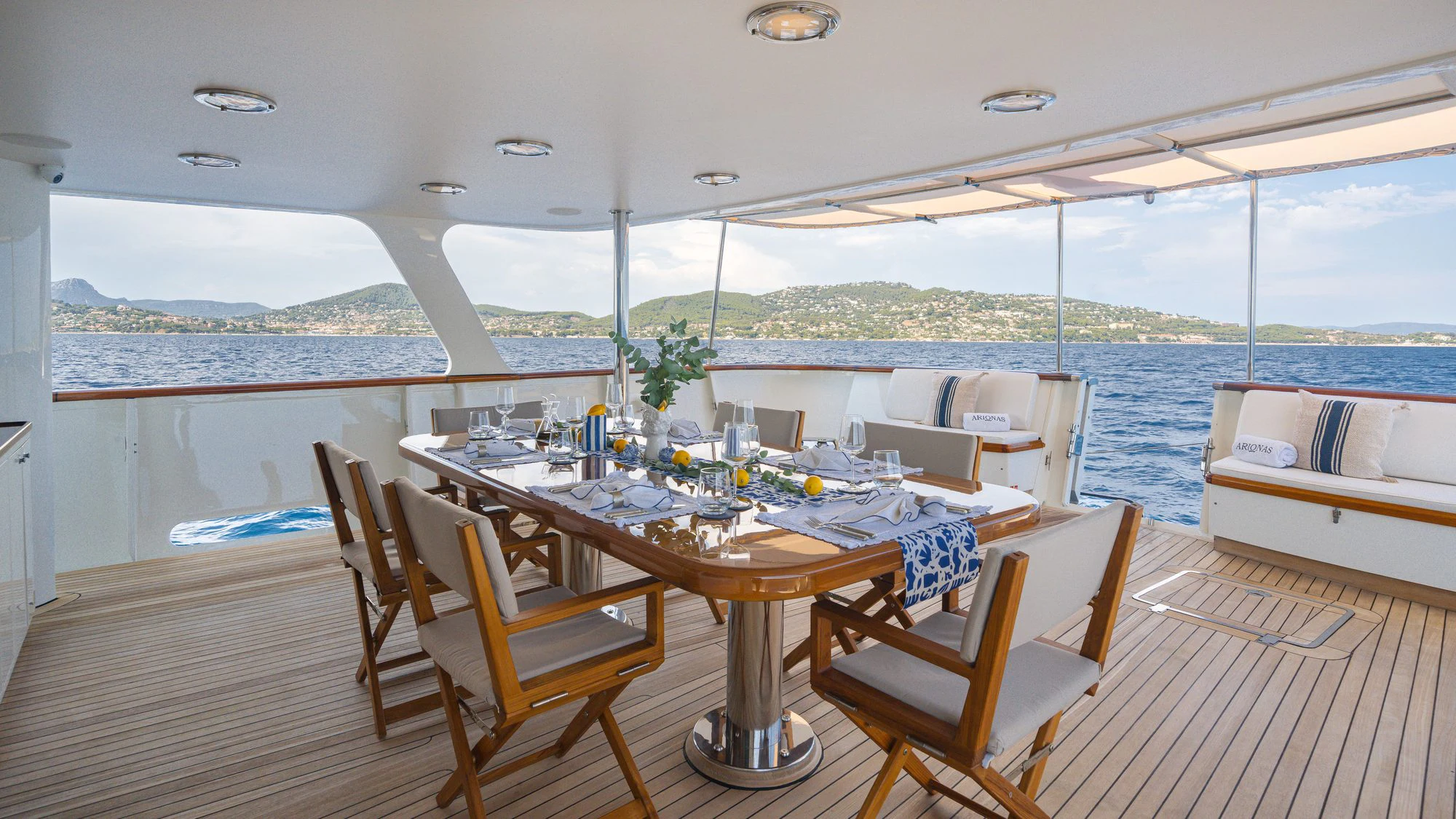 a table on a deck aboard ARIONAS Yacht for Charter