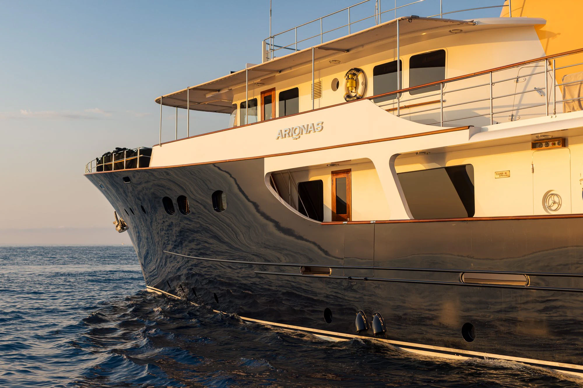 a large white boat in the water aboard ARIONAS Yacht for Charter
