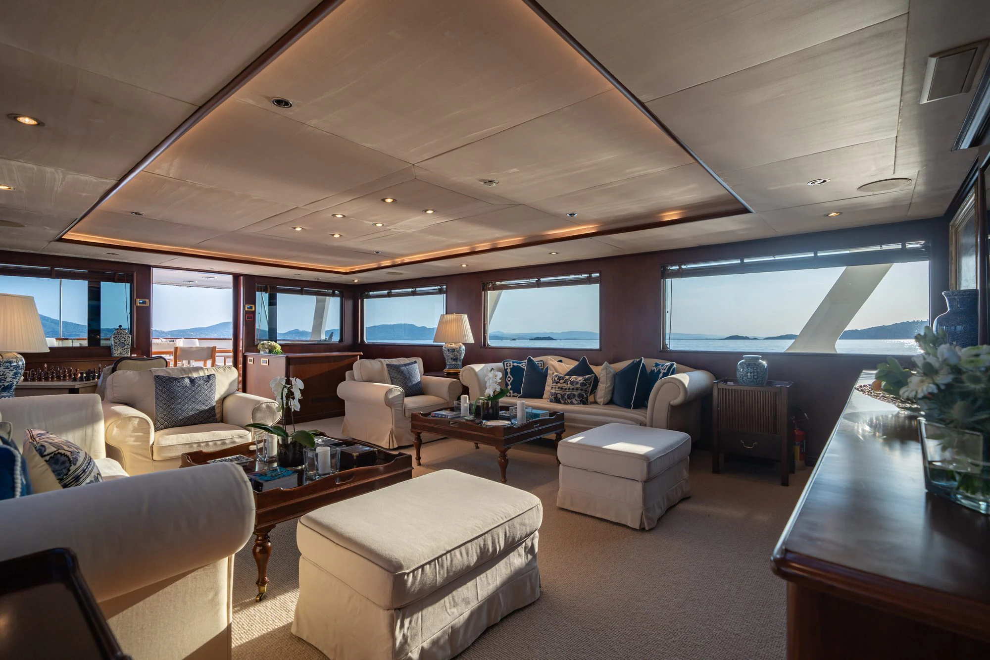 a living room with a large window aboard ARIONAS Yacht for Charter
