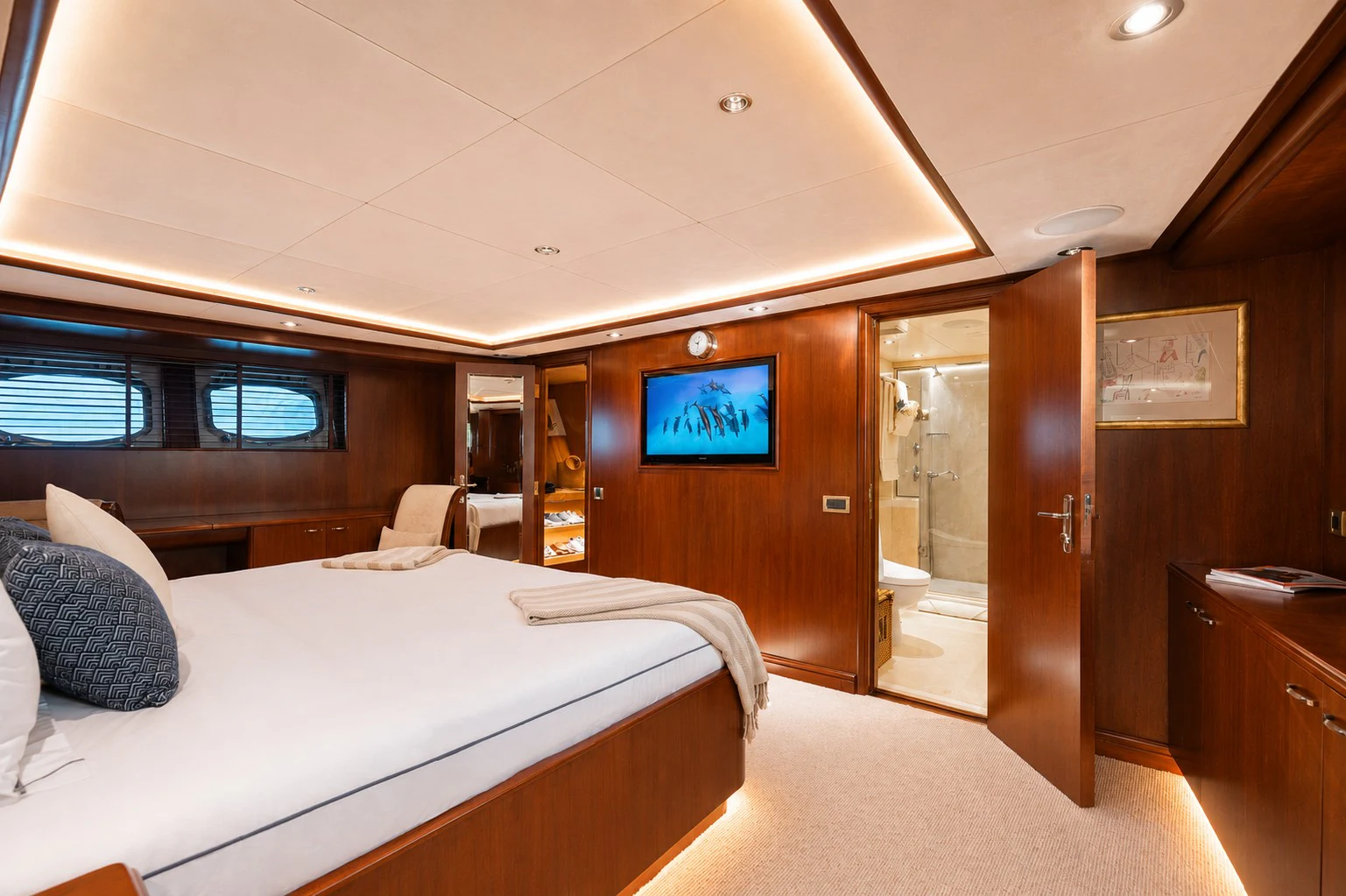a room with a bed and a tv on the wall aboard ARIONAS Yacht for Charter