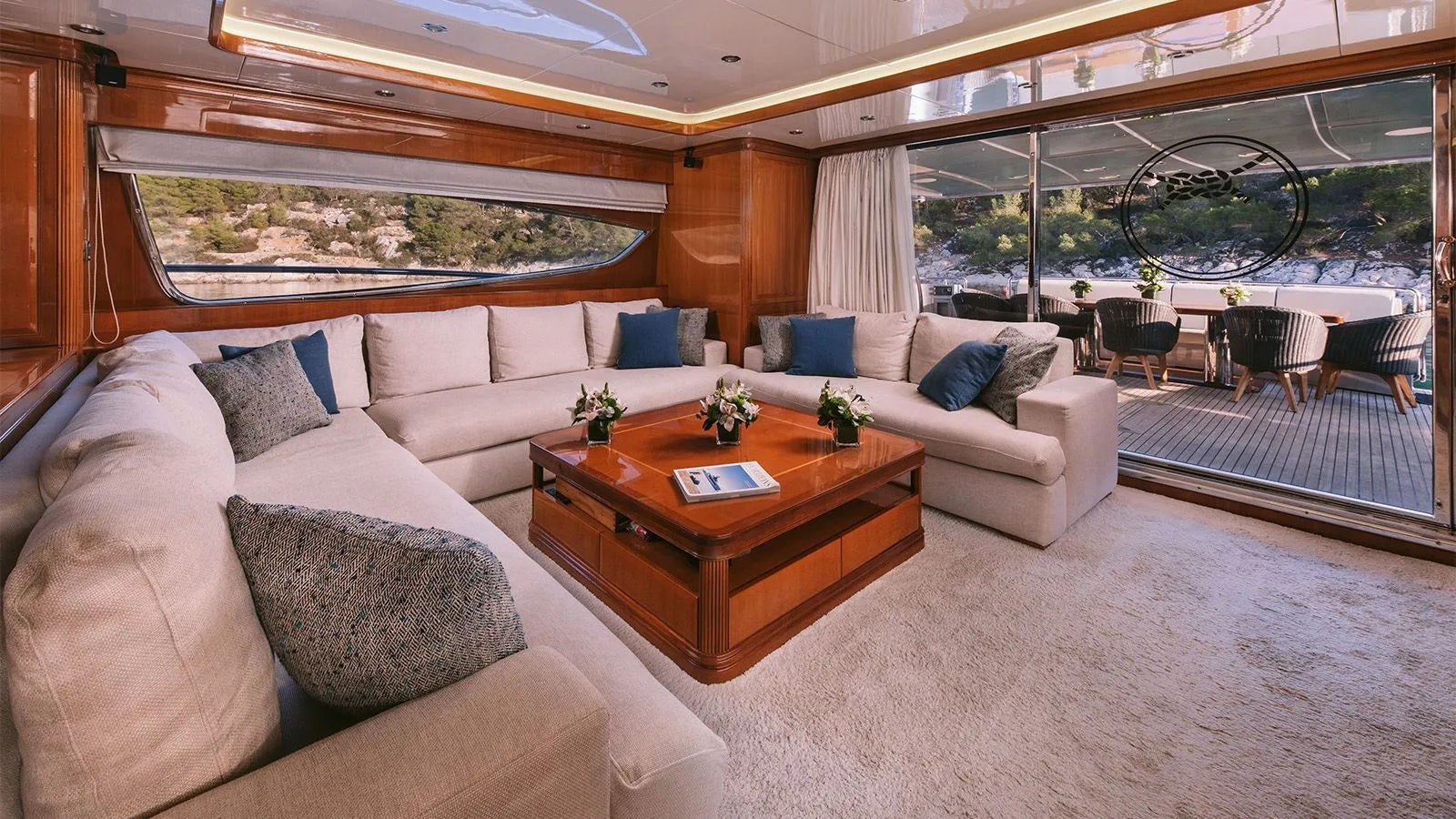 a living room with a couch and a table aboard ELVI Yacht for Charter