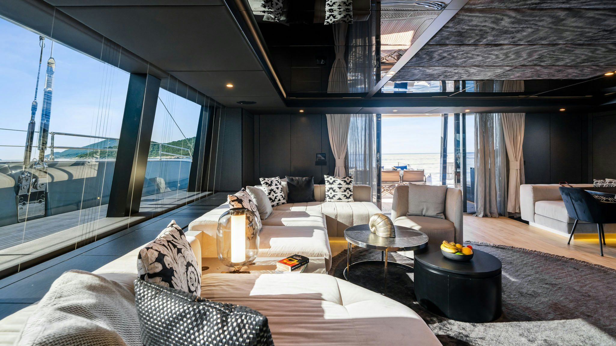 a living room with a large window aboard GRAYA Yacht for Charter