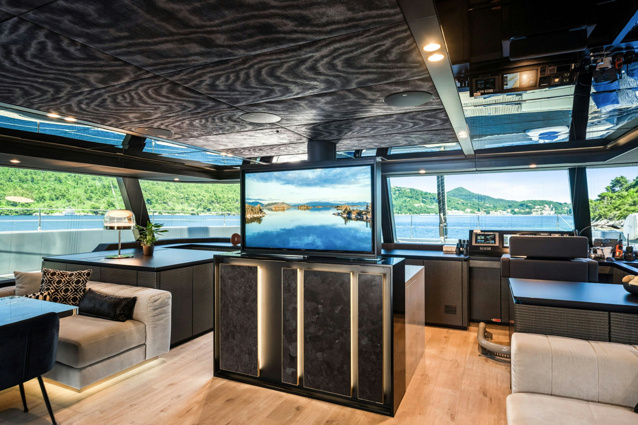 a room with a large screen aboard GRAYA Yacht for Charter