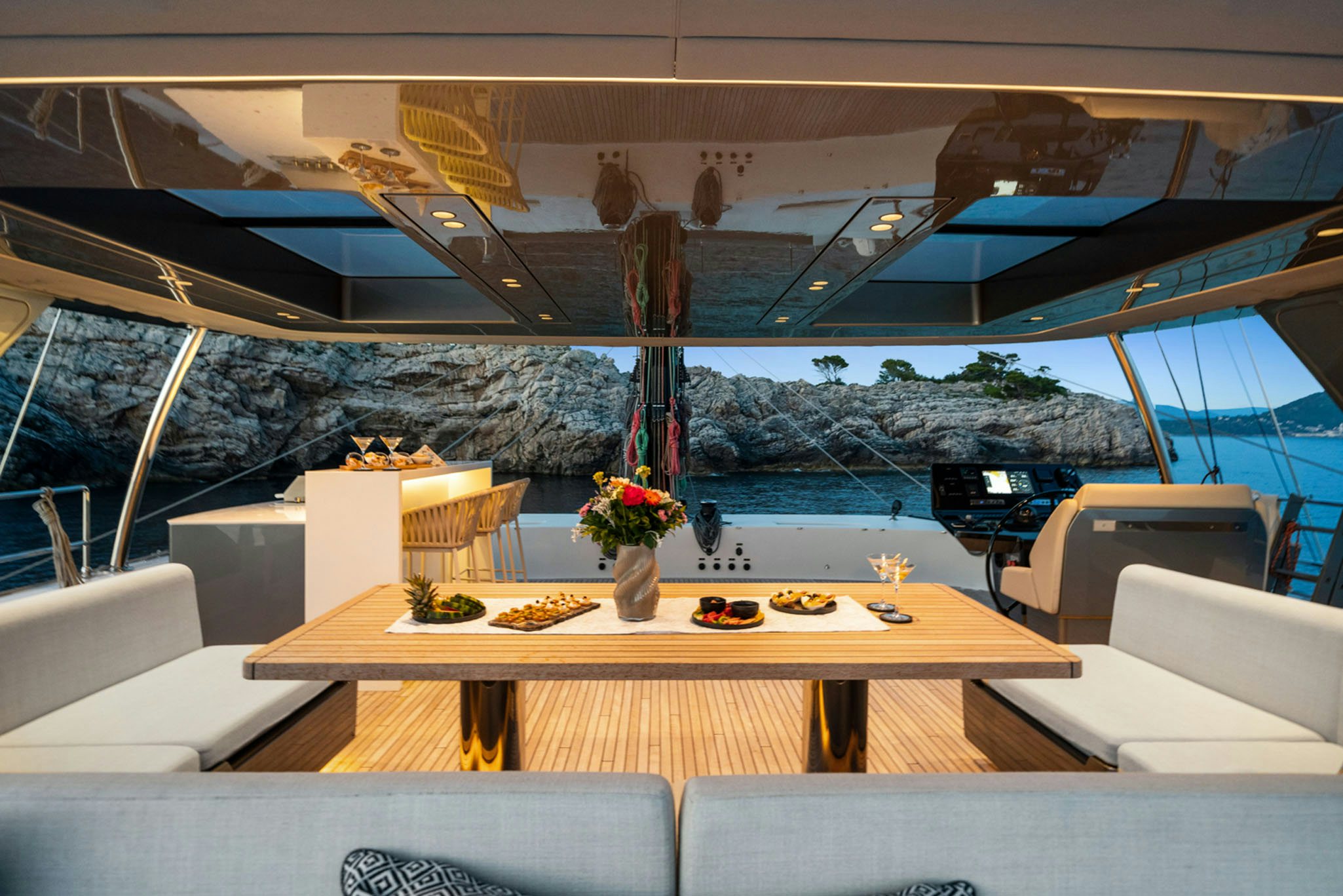 a room with a table and chairs aboard GRAYA Yacht for Charter